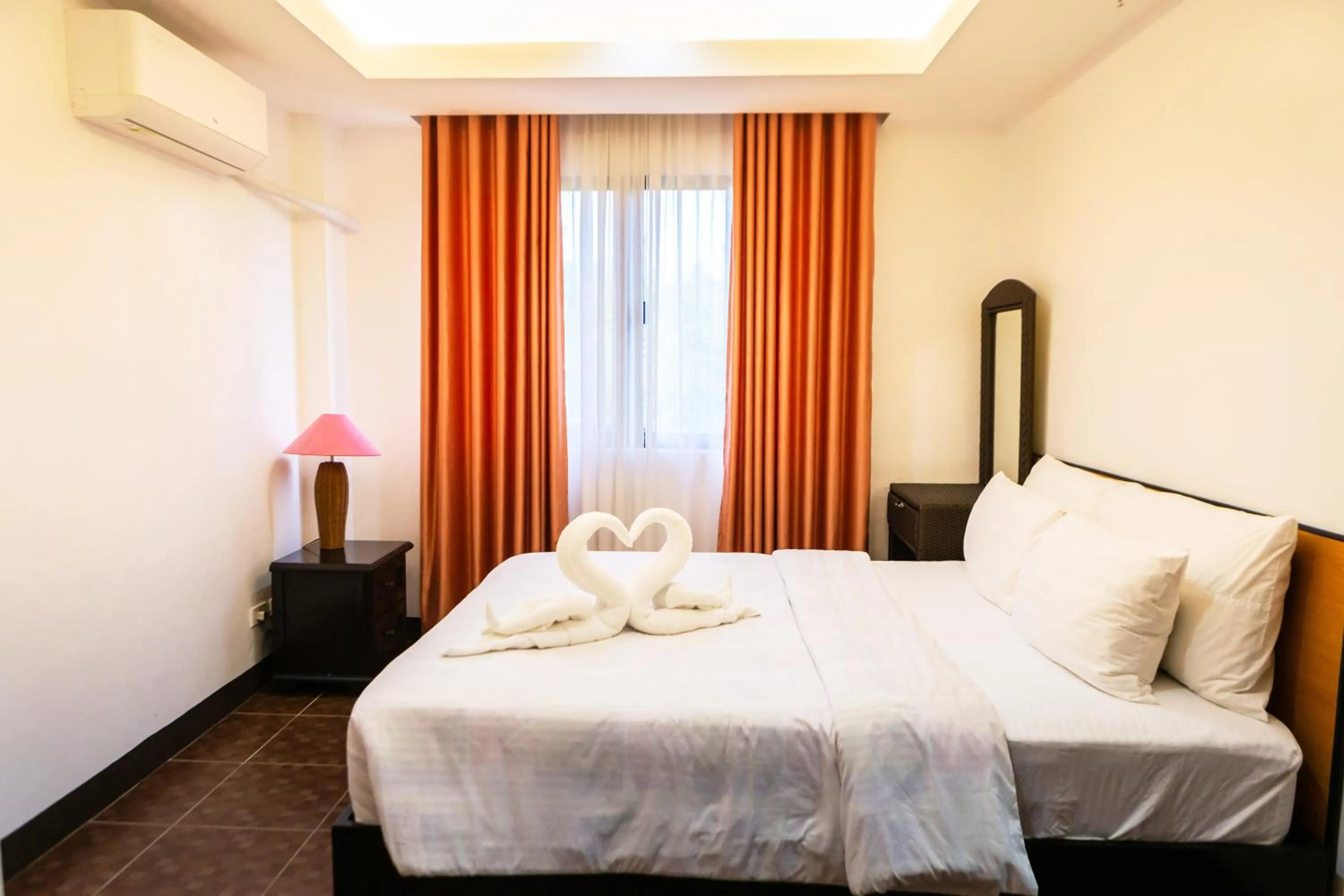 Bed in Palmbeach Resort Mactan Cebu powered by Cocotel