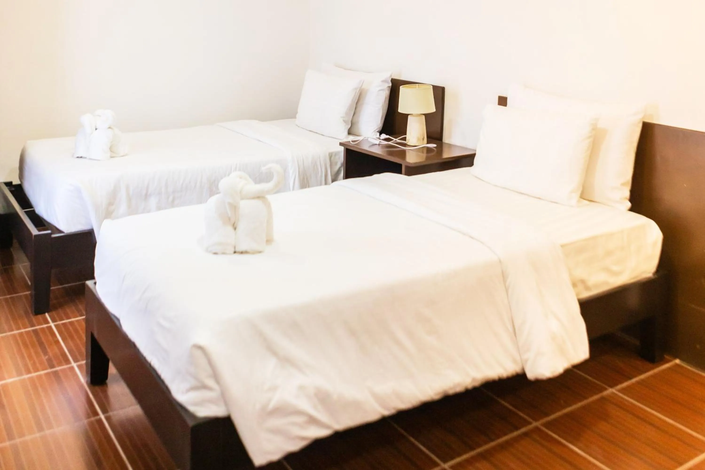 Bed in Palmbeach Resort Mactan Cebu powered by Cocotel