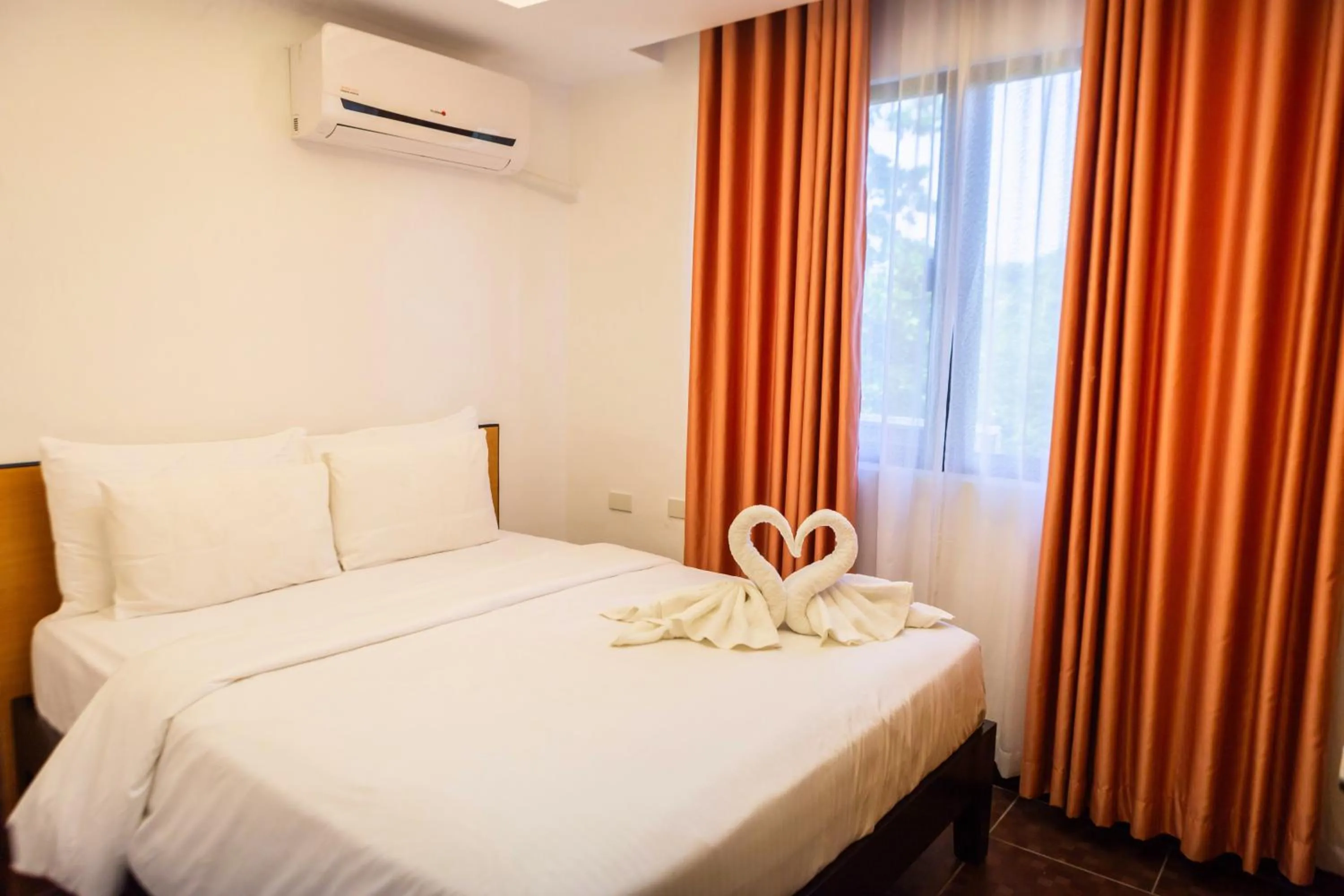 Bed in Palmbeach Resort Mactan Cebu powered by Cocotel