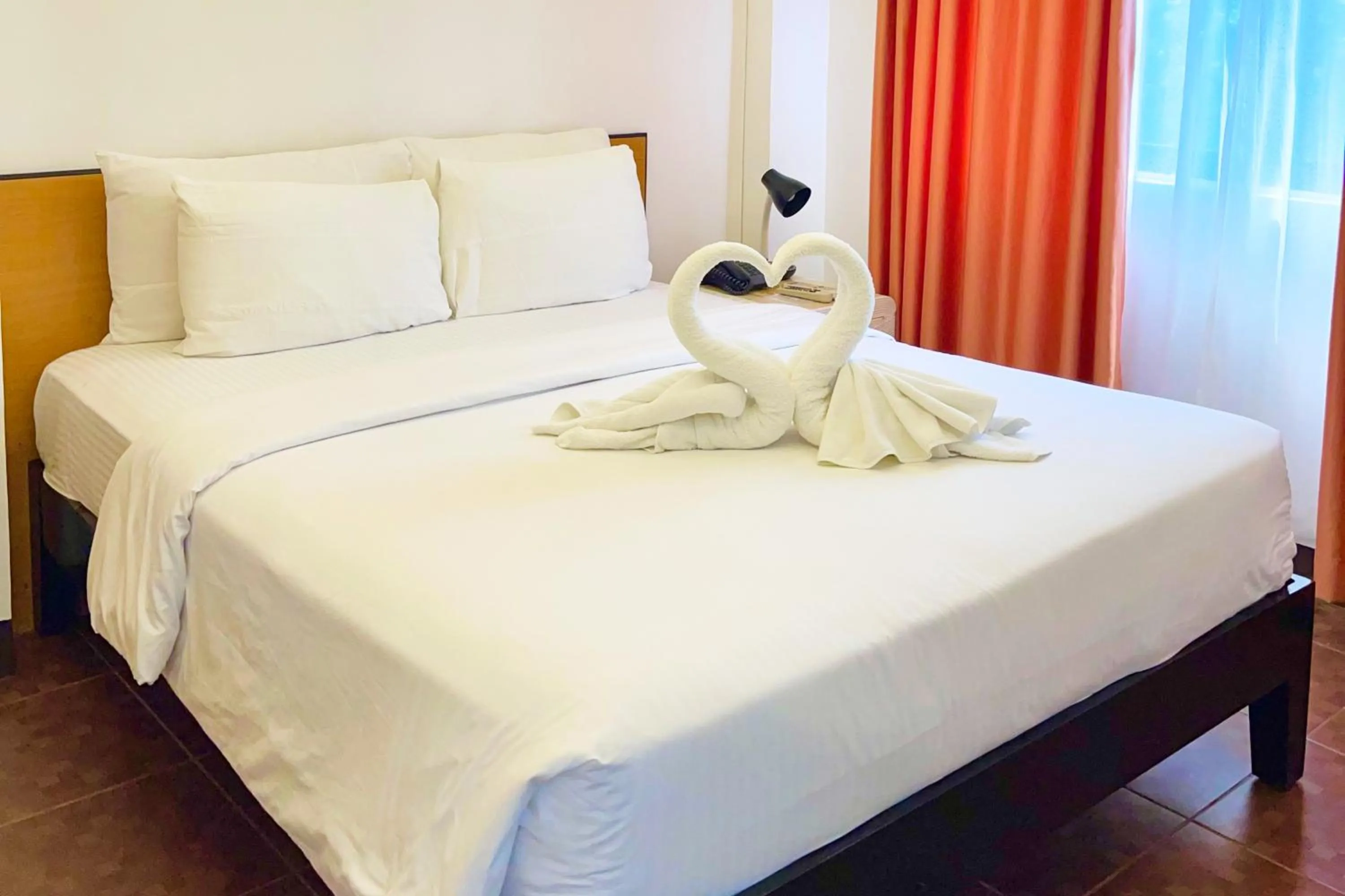 Bed in Palmbeach Resort Mactan Cebu powered by Cocotel