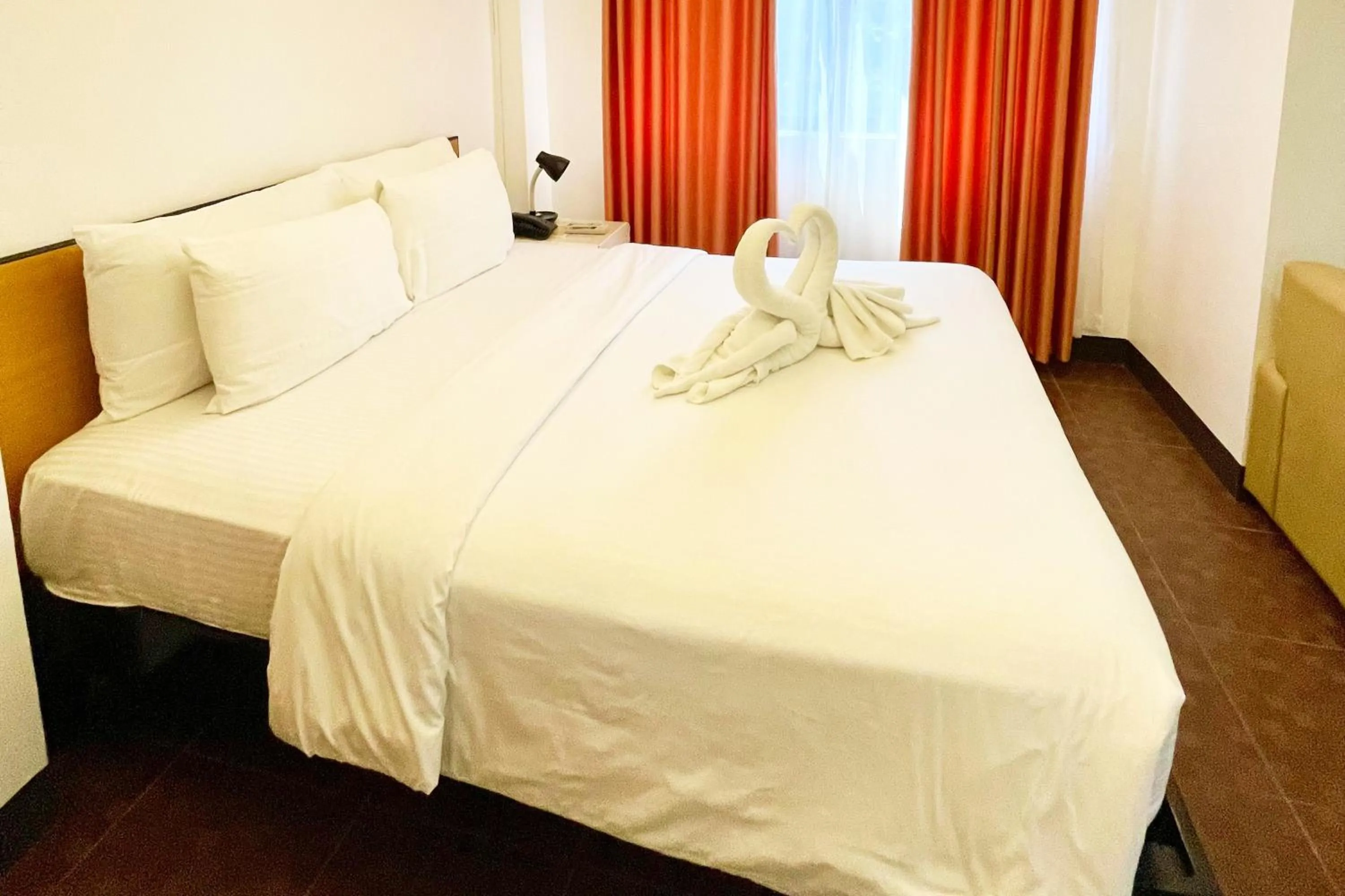 Bed in Palmbeach Resort Mactan Cebu powered by Cocotel