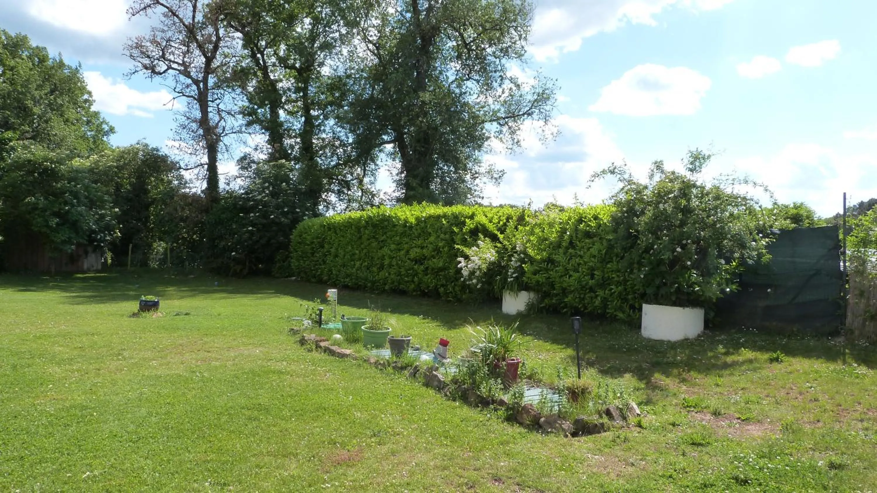 Garden in Logis Hôtel Restaurant La Borie