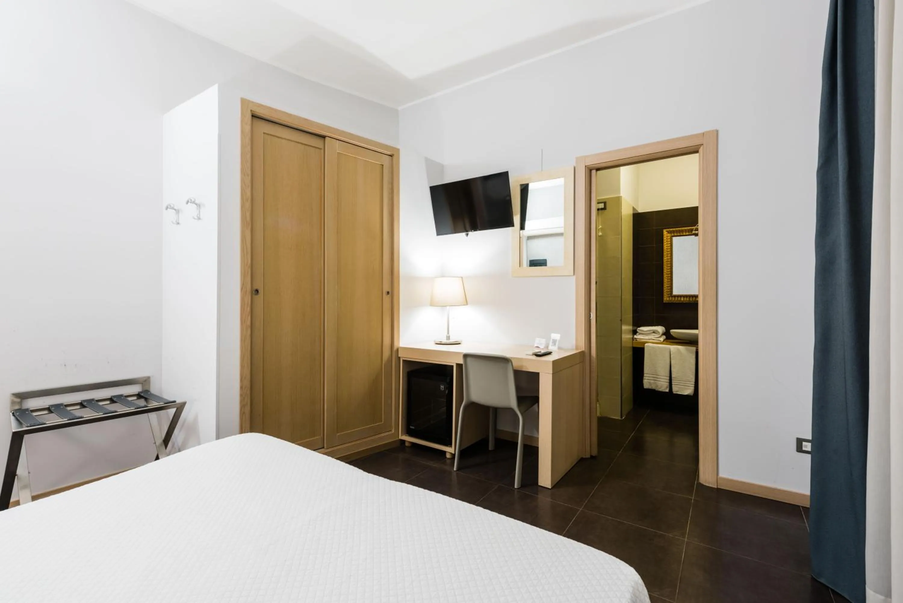 Bed in BeBIGEA Rooms