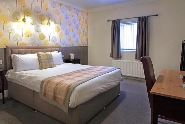 Bed in The Marine Hotel