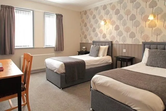 Bed in The Marine Hotel