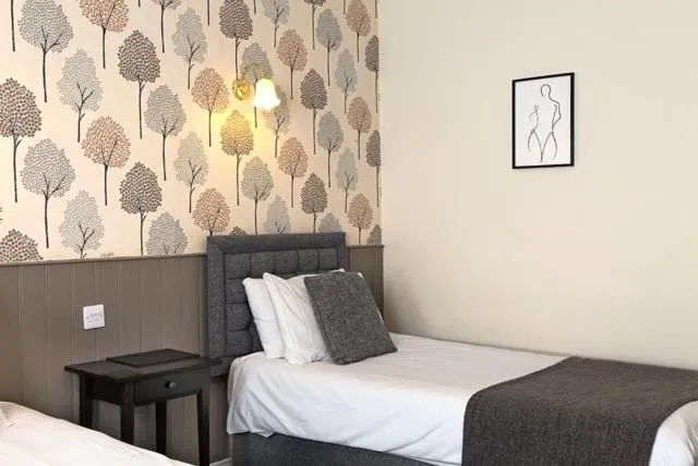 Bed in The Marine Hotel