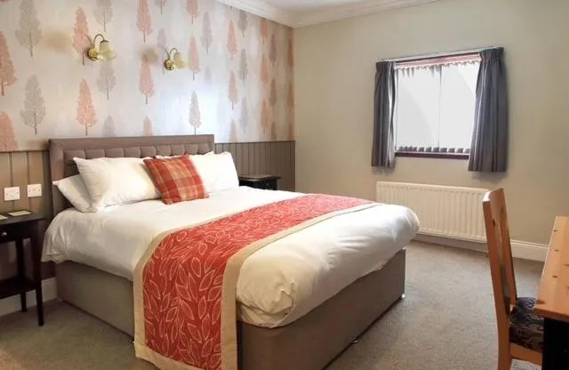 Bed in The Marine Hotel