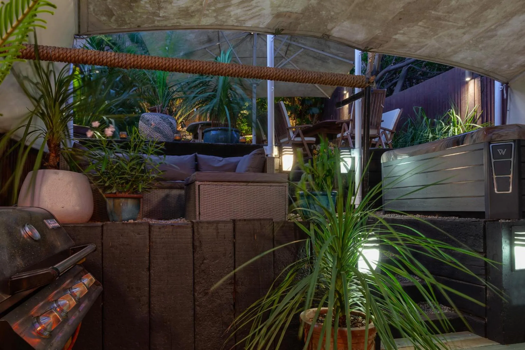 Patio in Zanzibar House 8-Bedroom Holiday House with Hot Tub & Yoga Studio