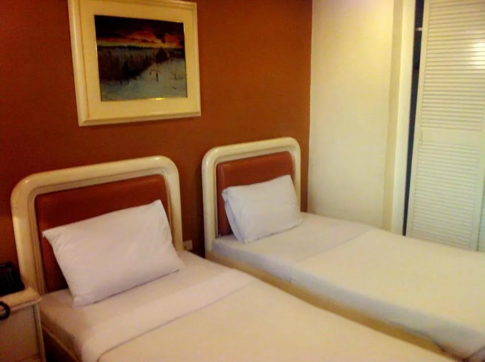 Bed in Lourdes Family Suites Makati powered by Cocotel