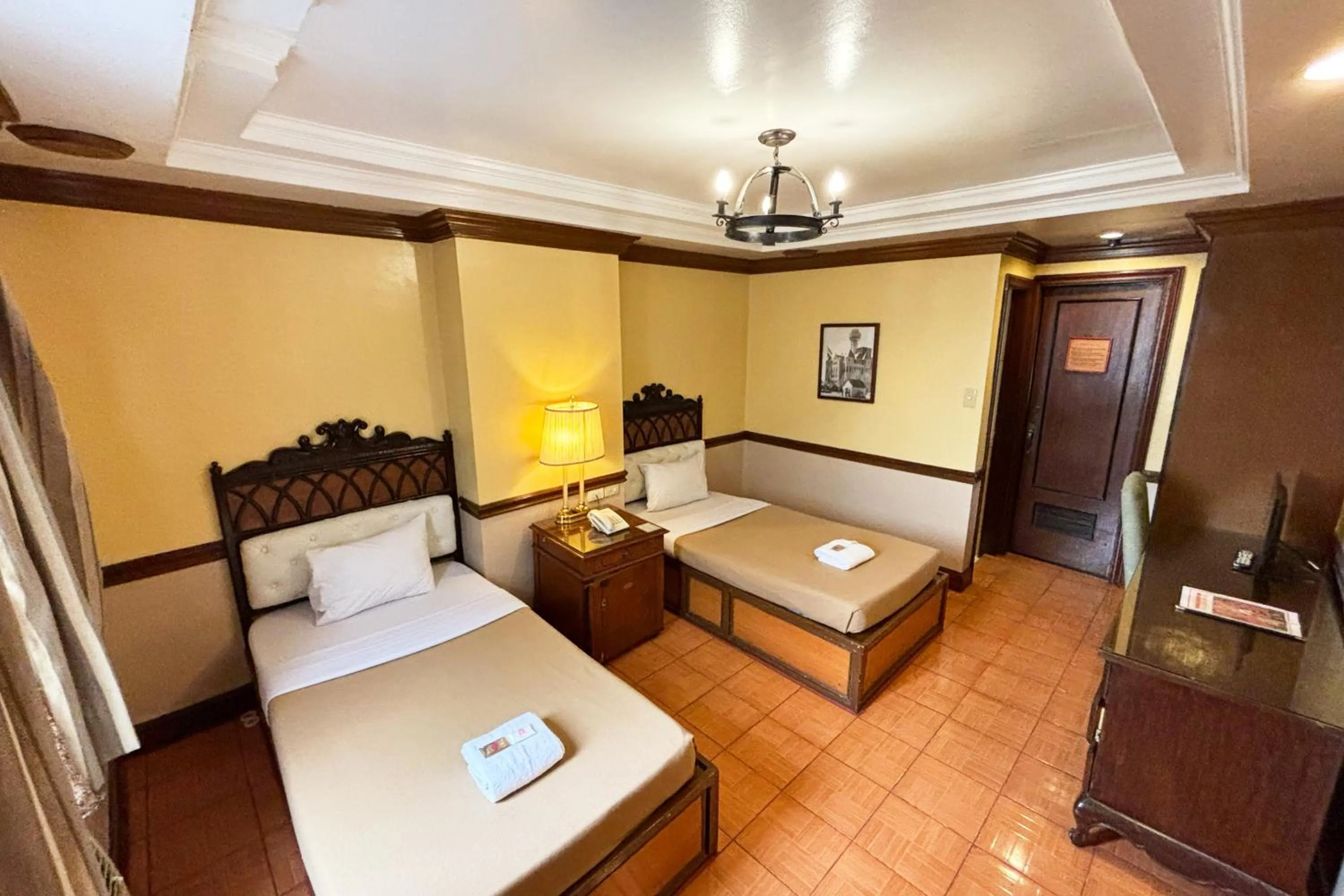 Bed in Camelot Hotel Quezon City powered by Cocotel