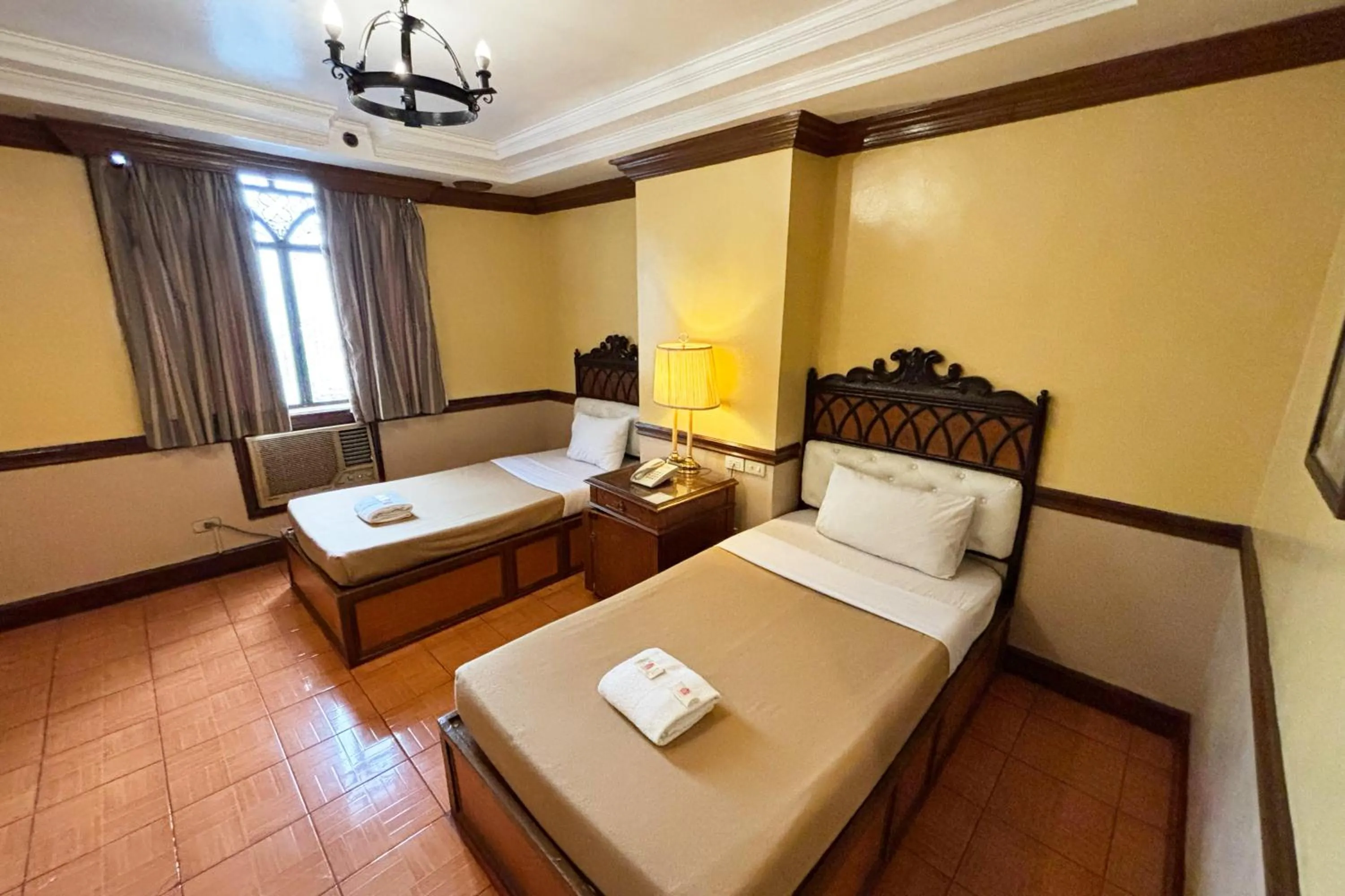 Bed in Camelot Hotel Quezon City powered by Cocotel