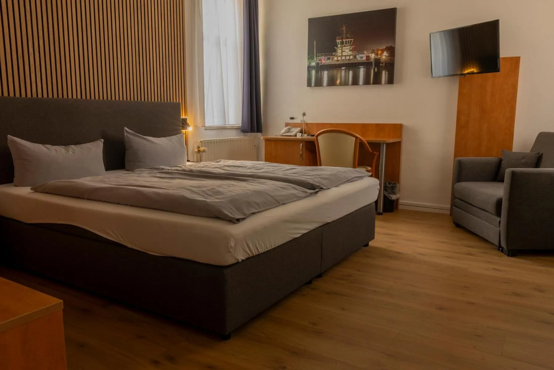 Photo of the whole room, Bed in Hotel Rendsburg