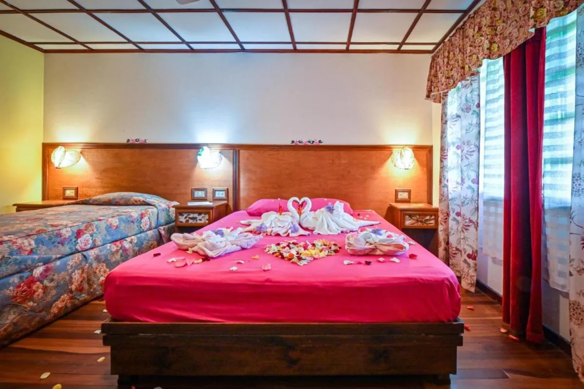 Bedroom, Bed in Lands in Love Hotel and Resort