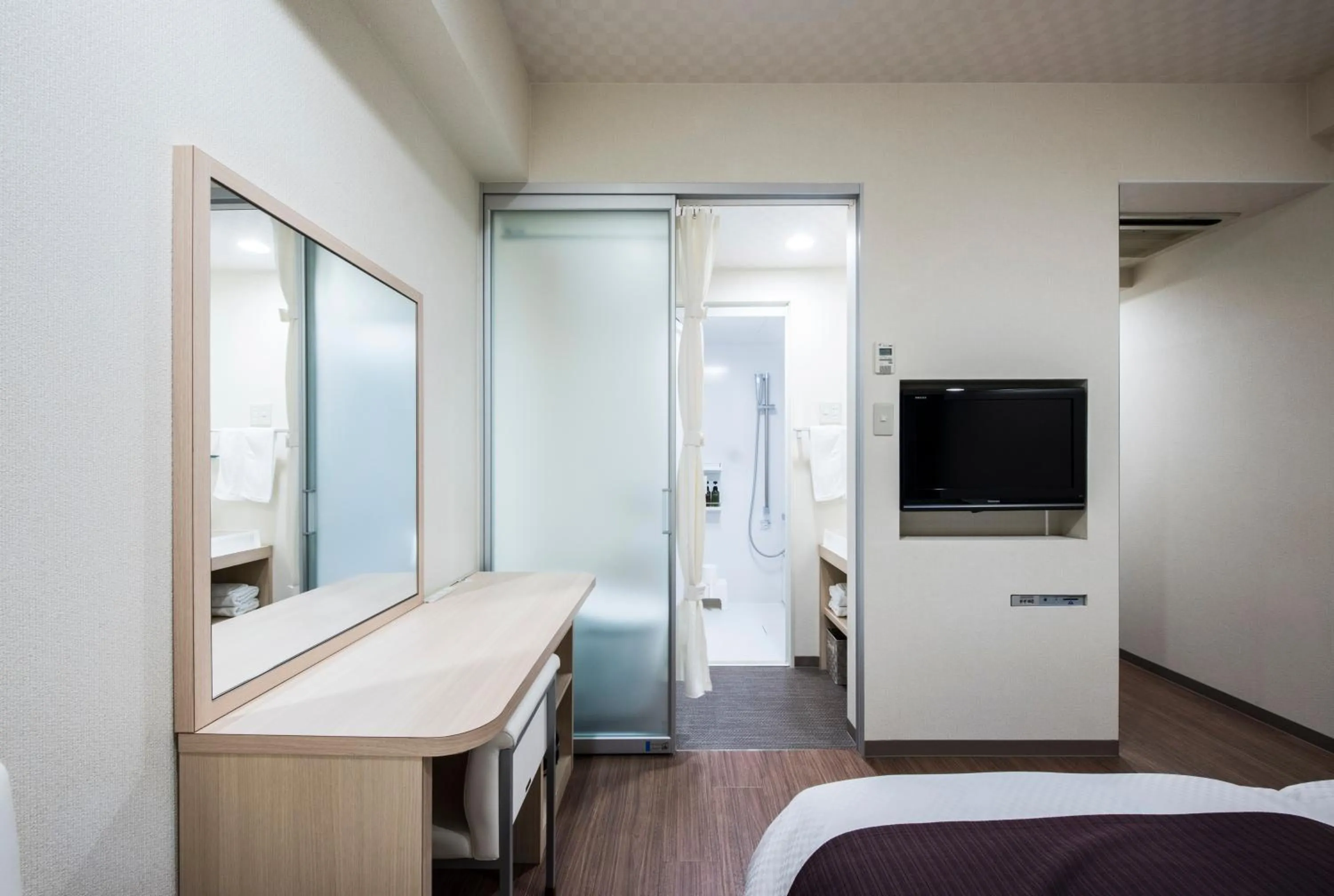 Photo of the whole room, Bed in Nagasaki Bus Terminal Hotel