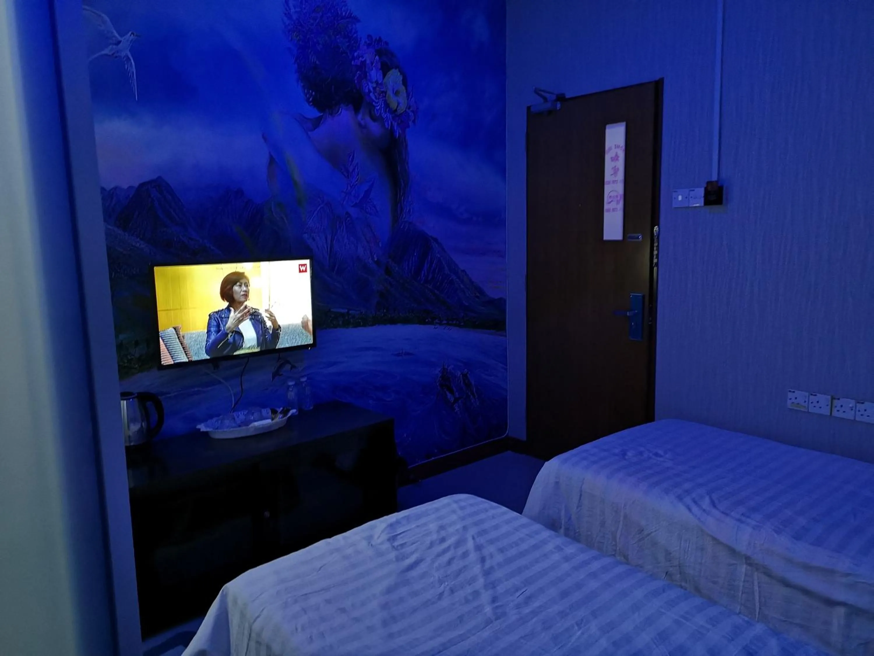 Bed in Home Inn Hotel