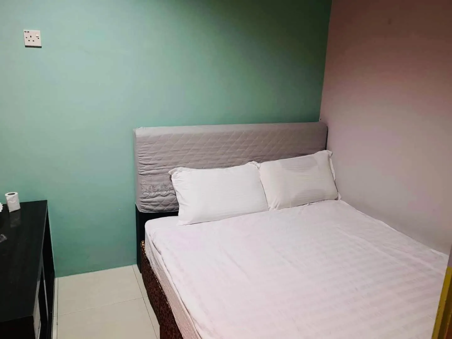 Bed in Home Inn Hotel