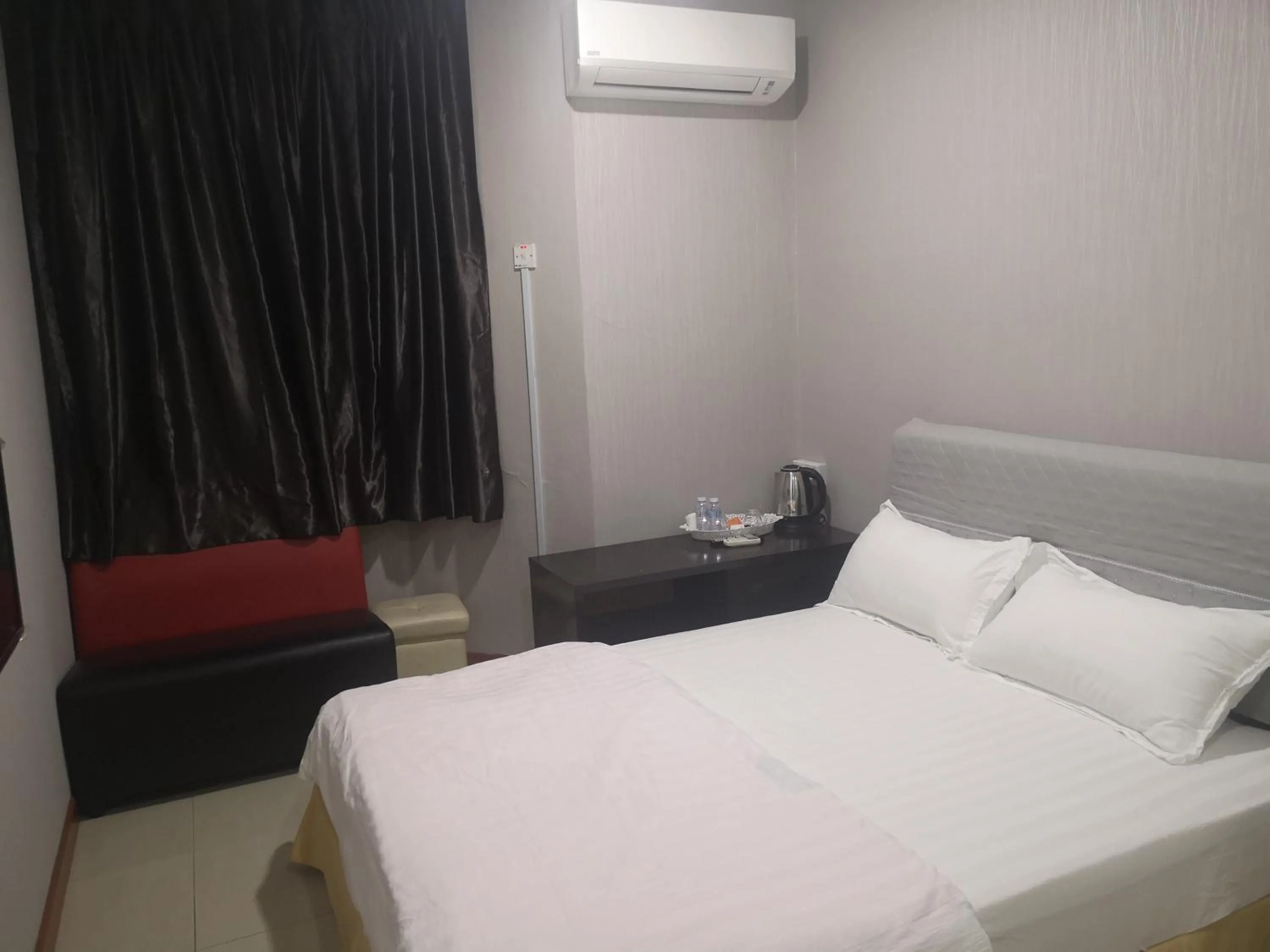 Bed in Home Inn Hotel