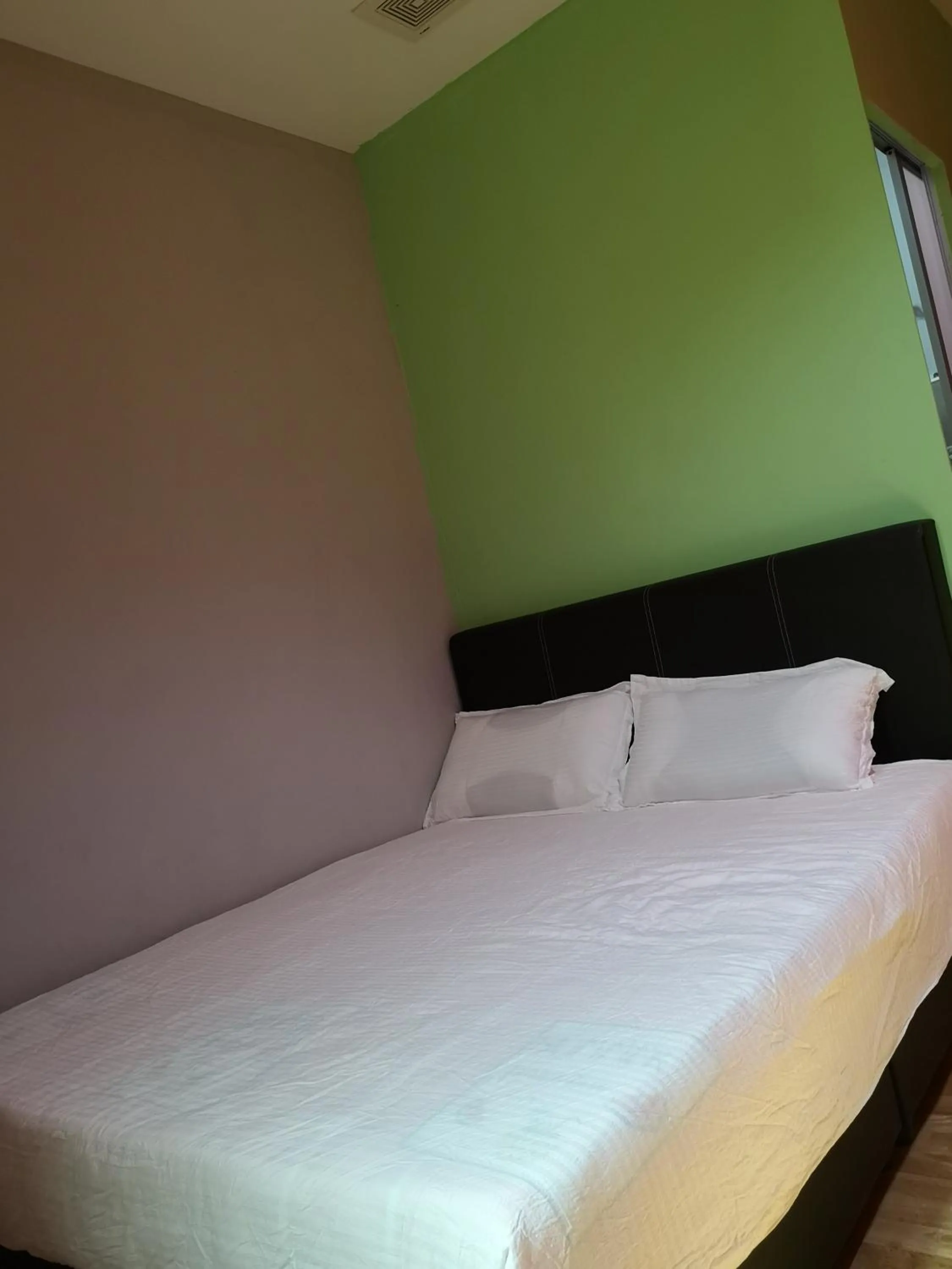 Bed in Home Inn Hotel