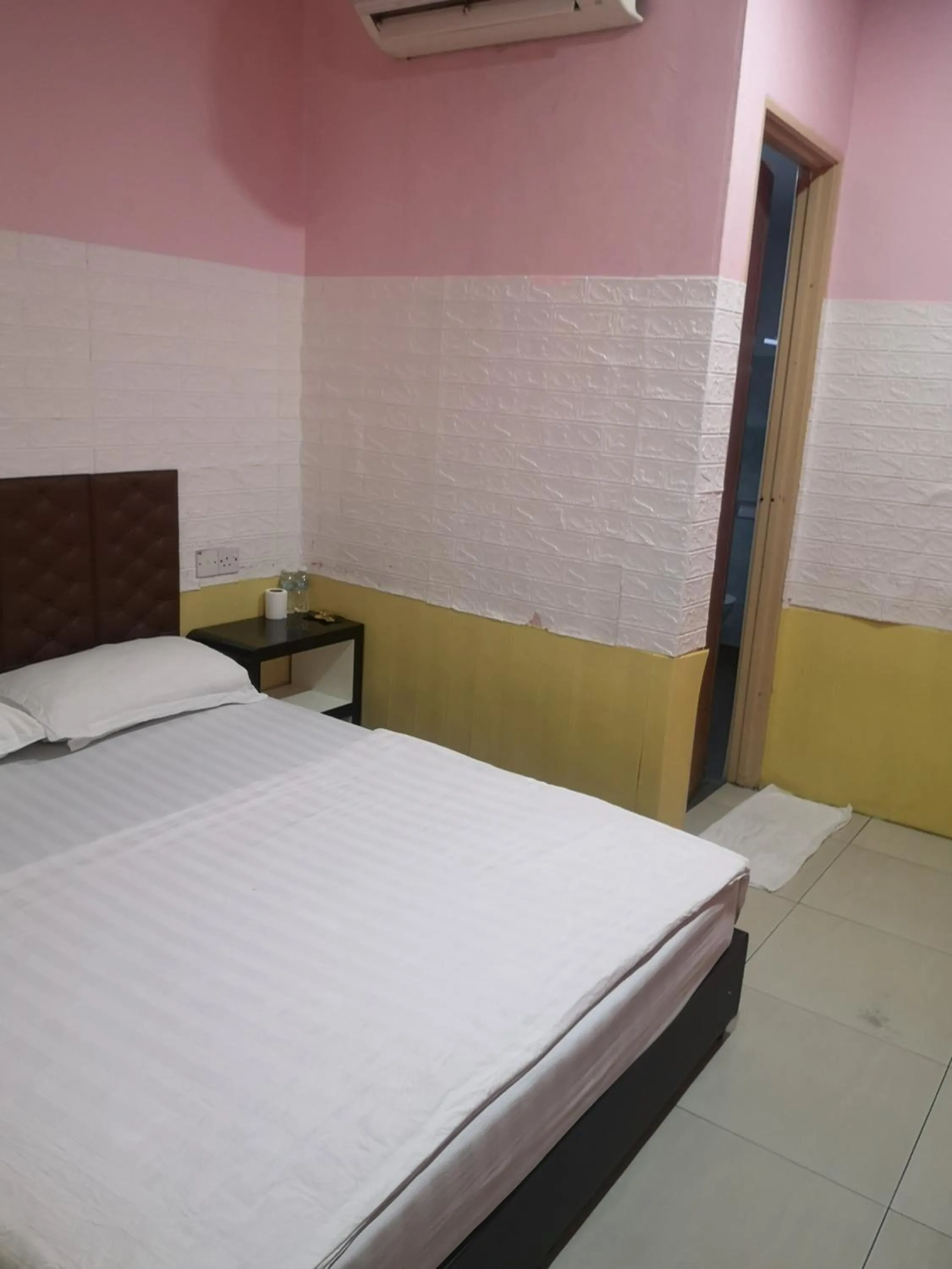 Bed in Home Inn Hotel