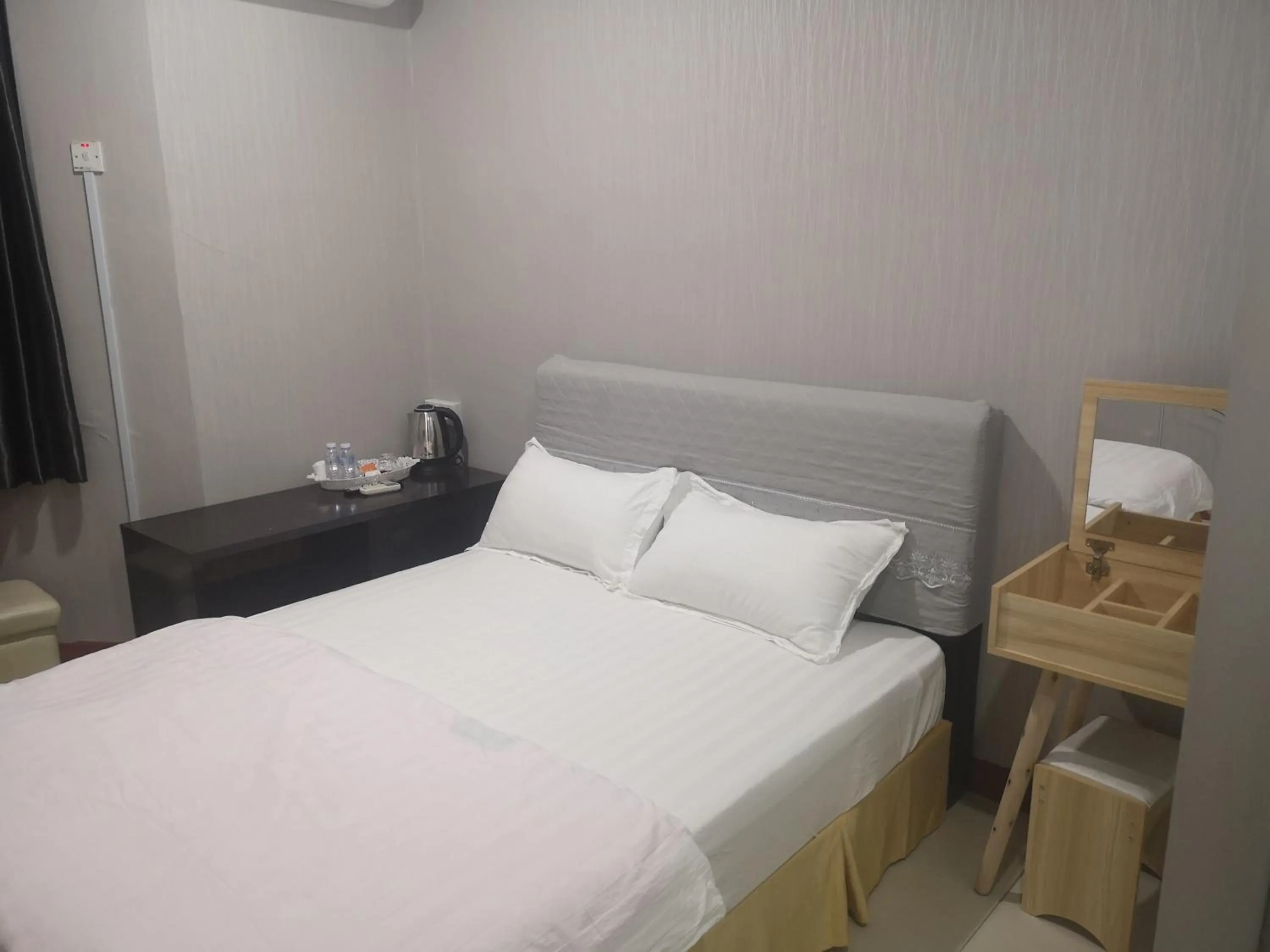 Bed in Home Inn Hotel