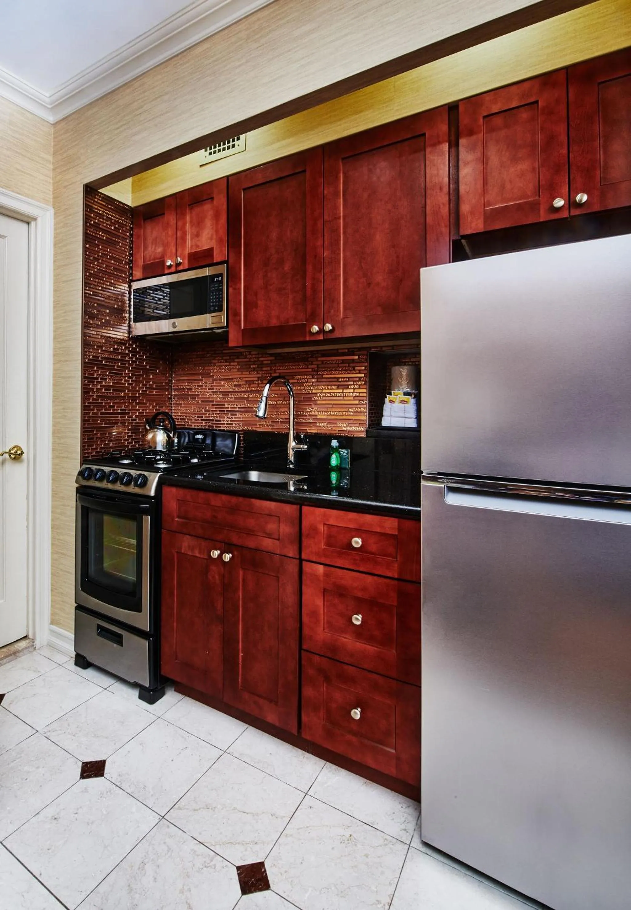 Kitchen or kitchenette in Radio City Apartments