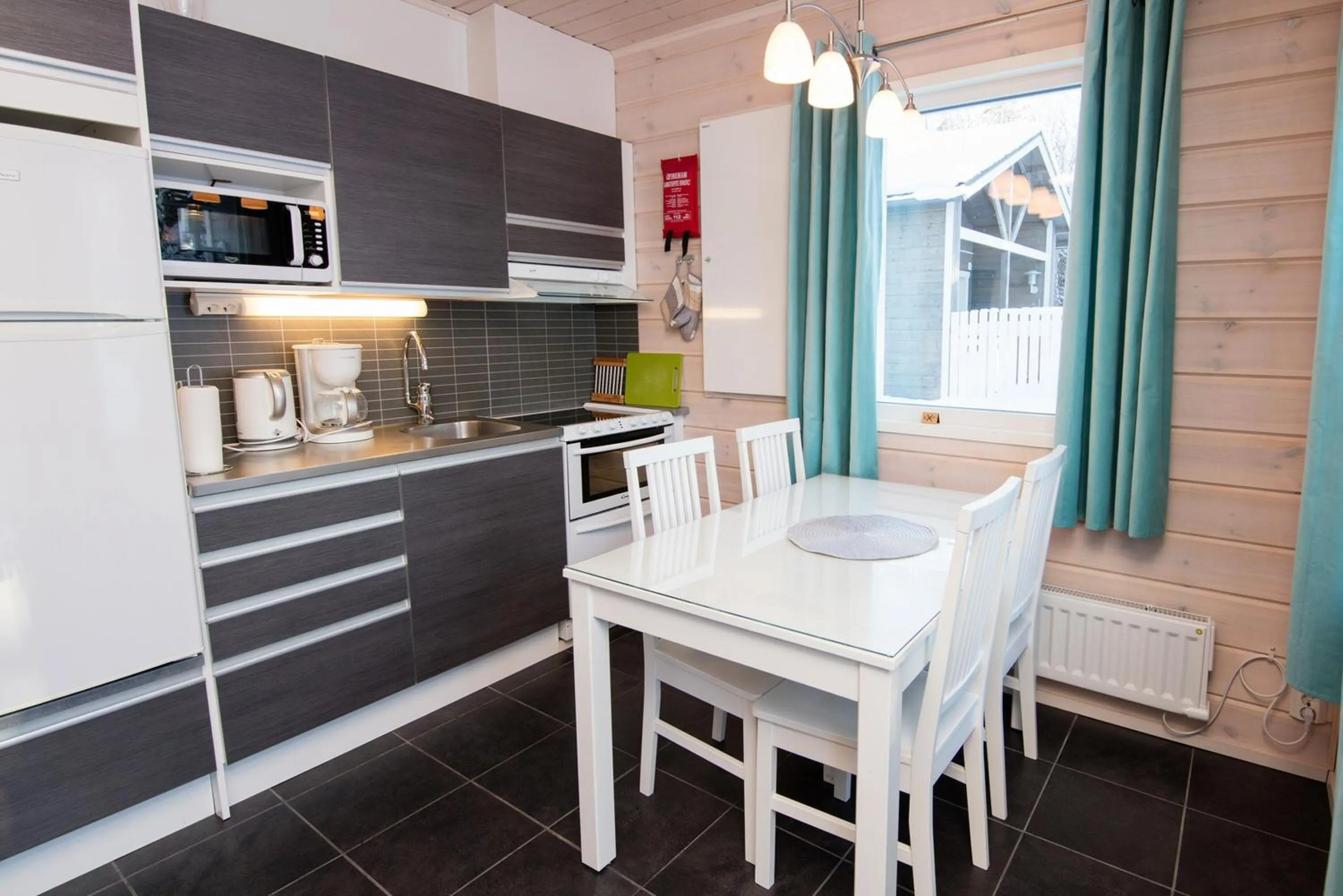 Kitchen or kitchenette in Kajaani Cottages