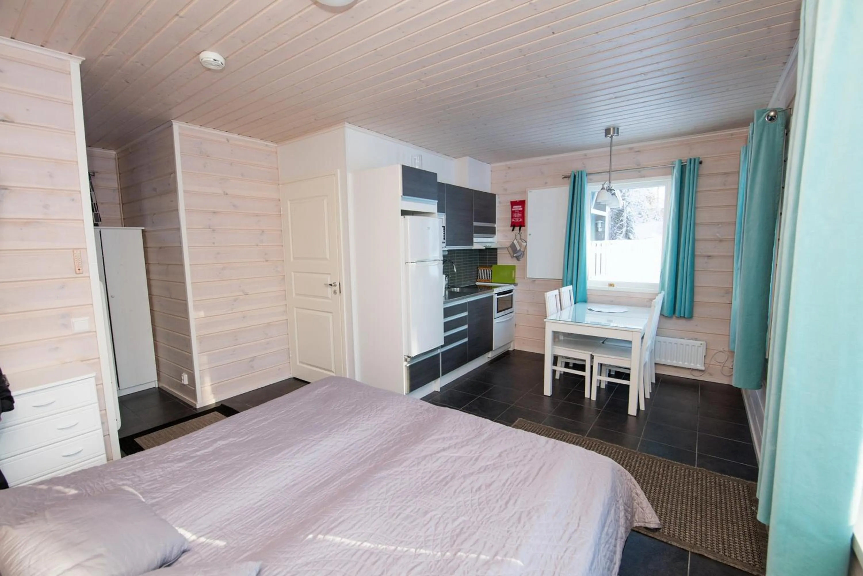 Seating area, Bed in Kajaani Cottages