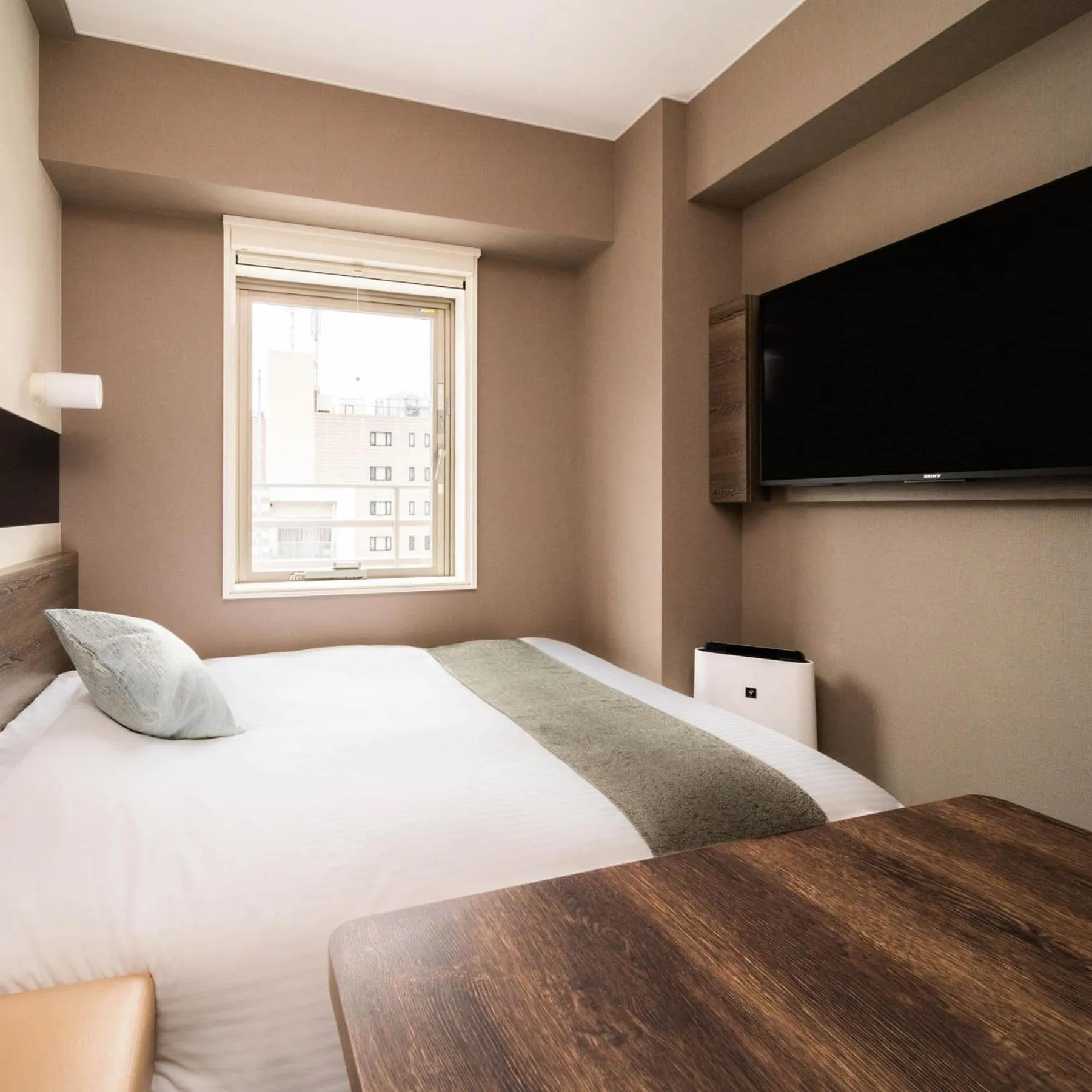 Bed in Super Hotel Premier Ginza