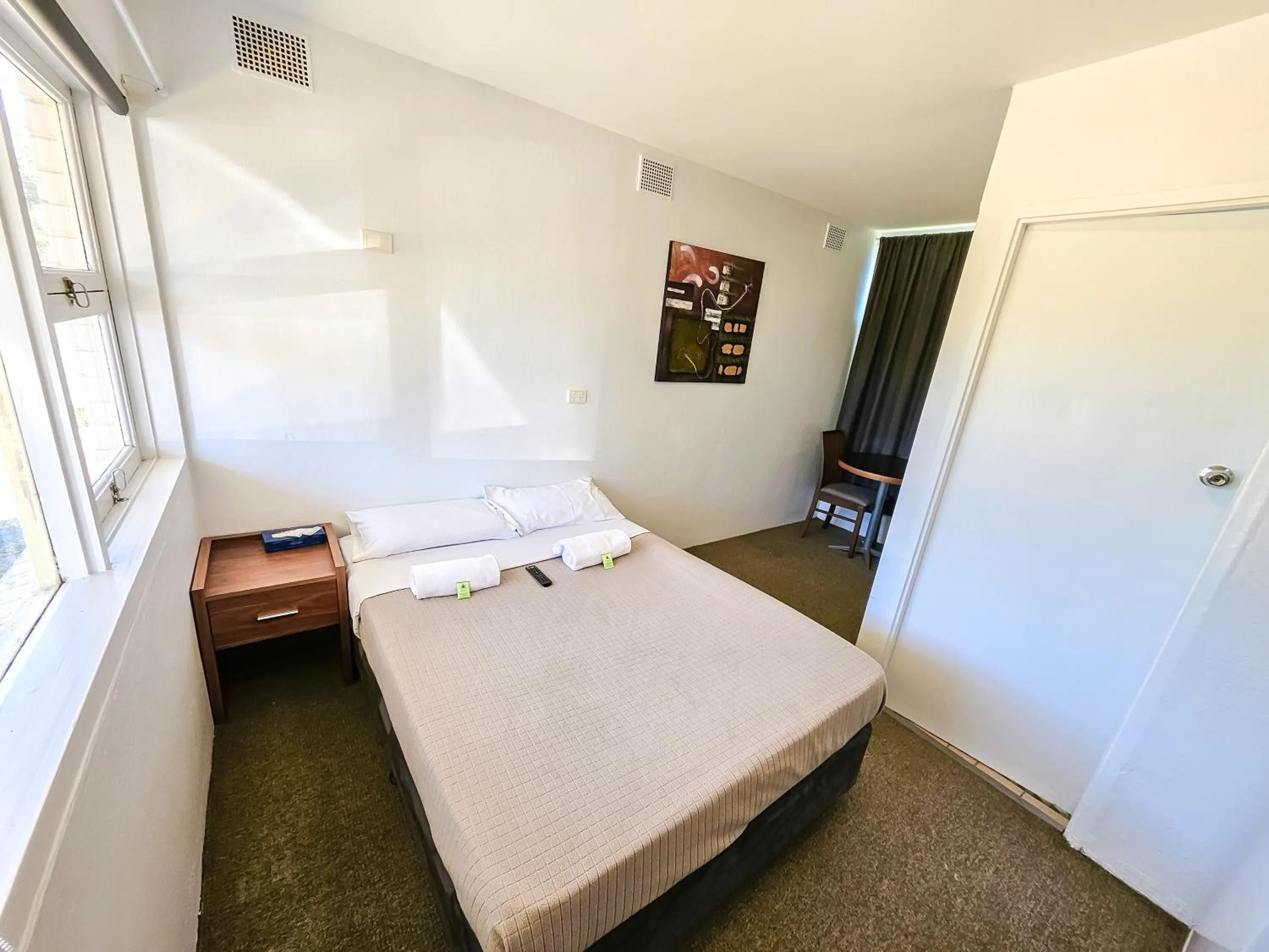 Bed in Green Door Motel