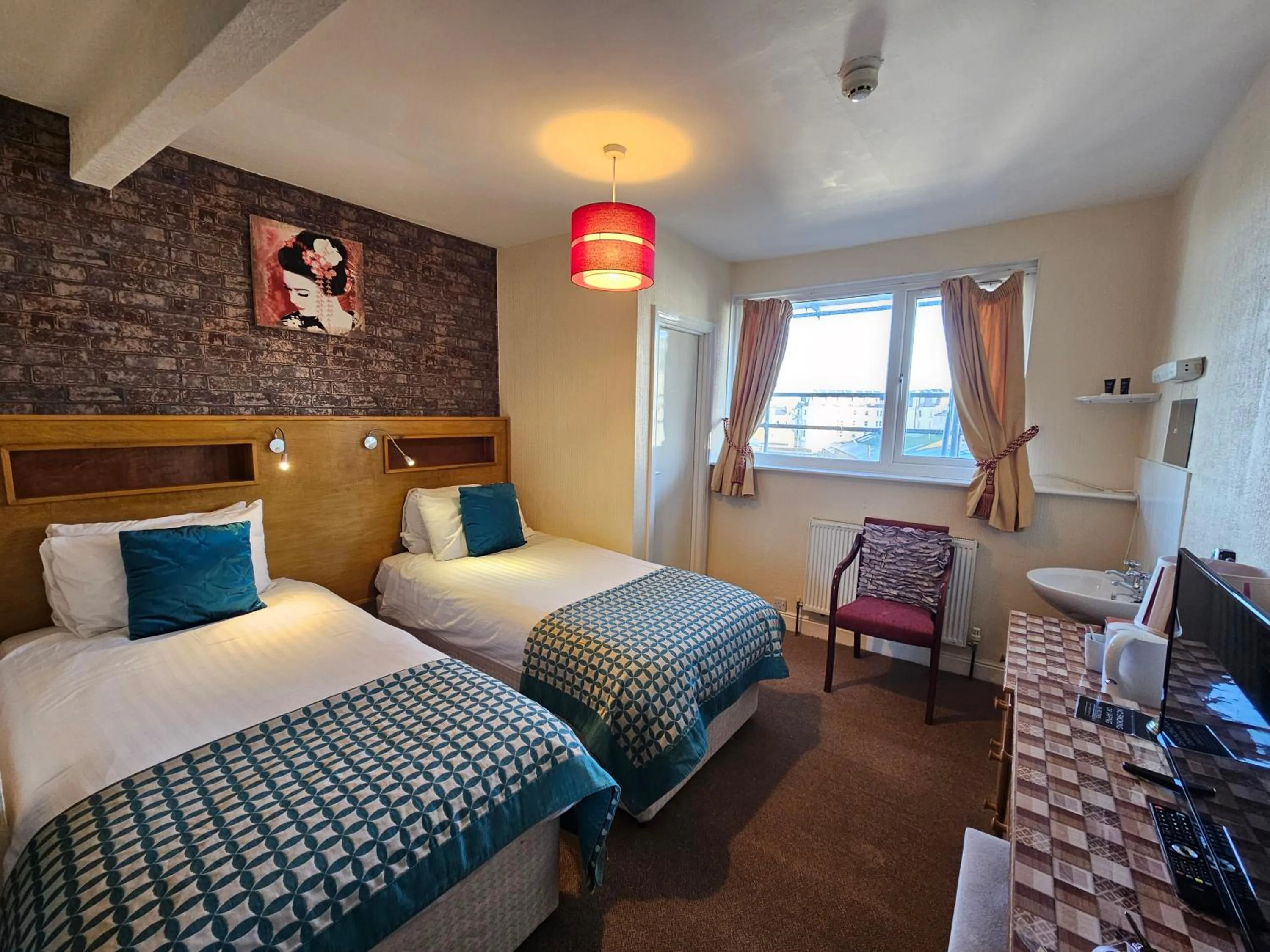 Bed in Rivelyn Hotel Bar & Restaurant