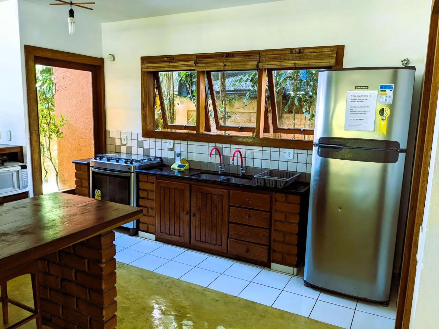 Kitchen or kitchenette in Residence Maria Vittoria Praia Arraial