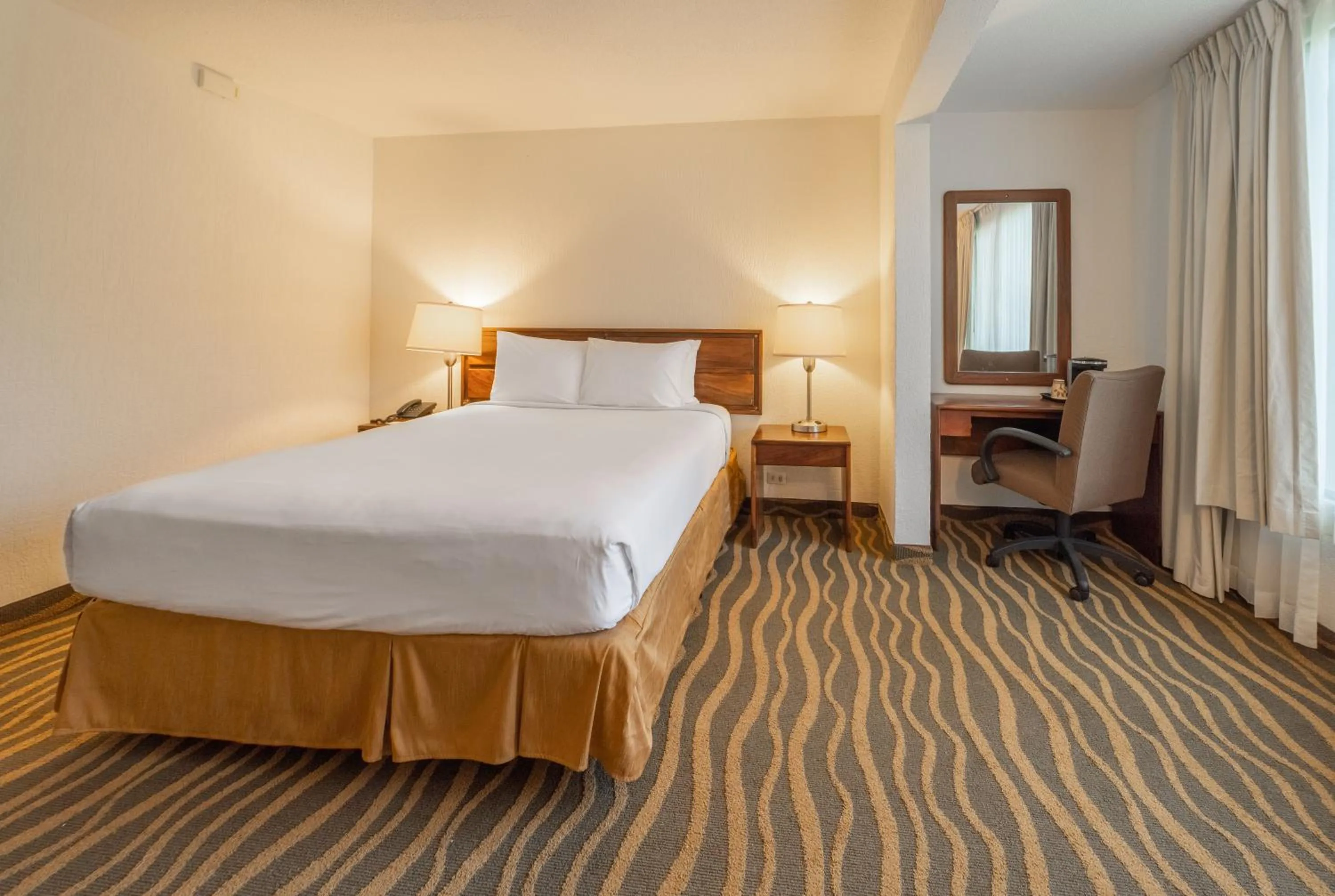 Bedroom, Bed in Irazú Hotel & Studios