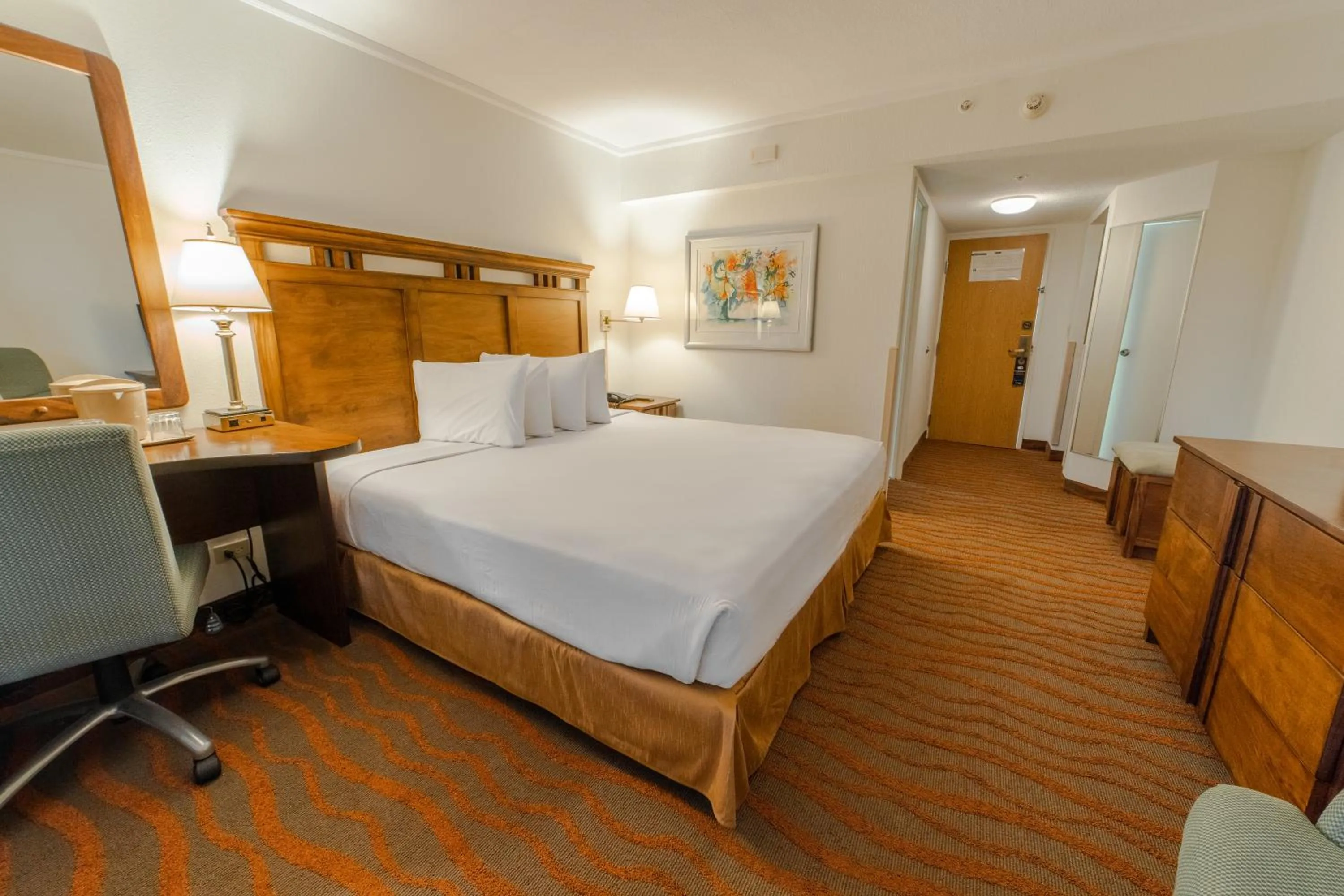 Bed in Irazú Hotel & Studios