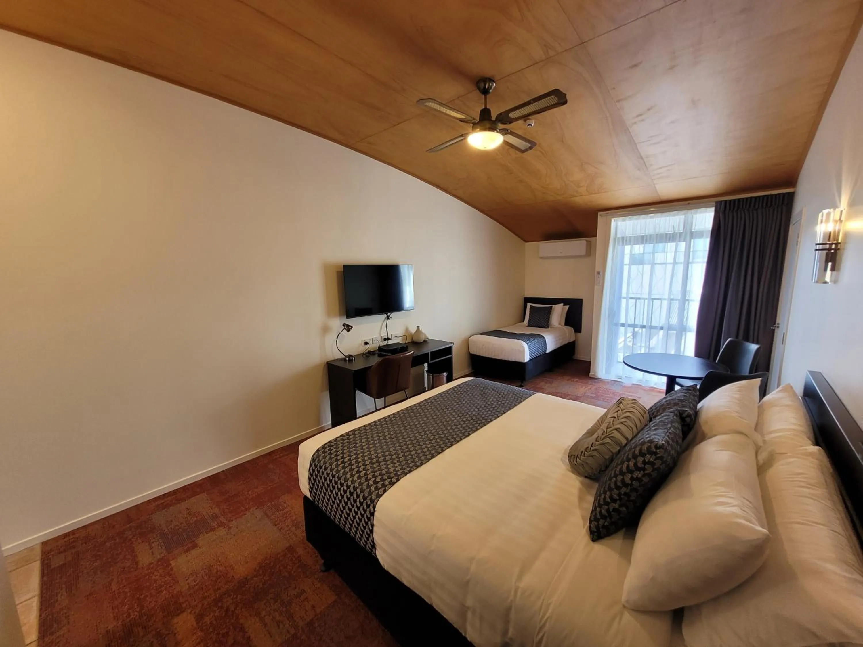 Bed in City of Sails Motel