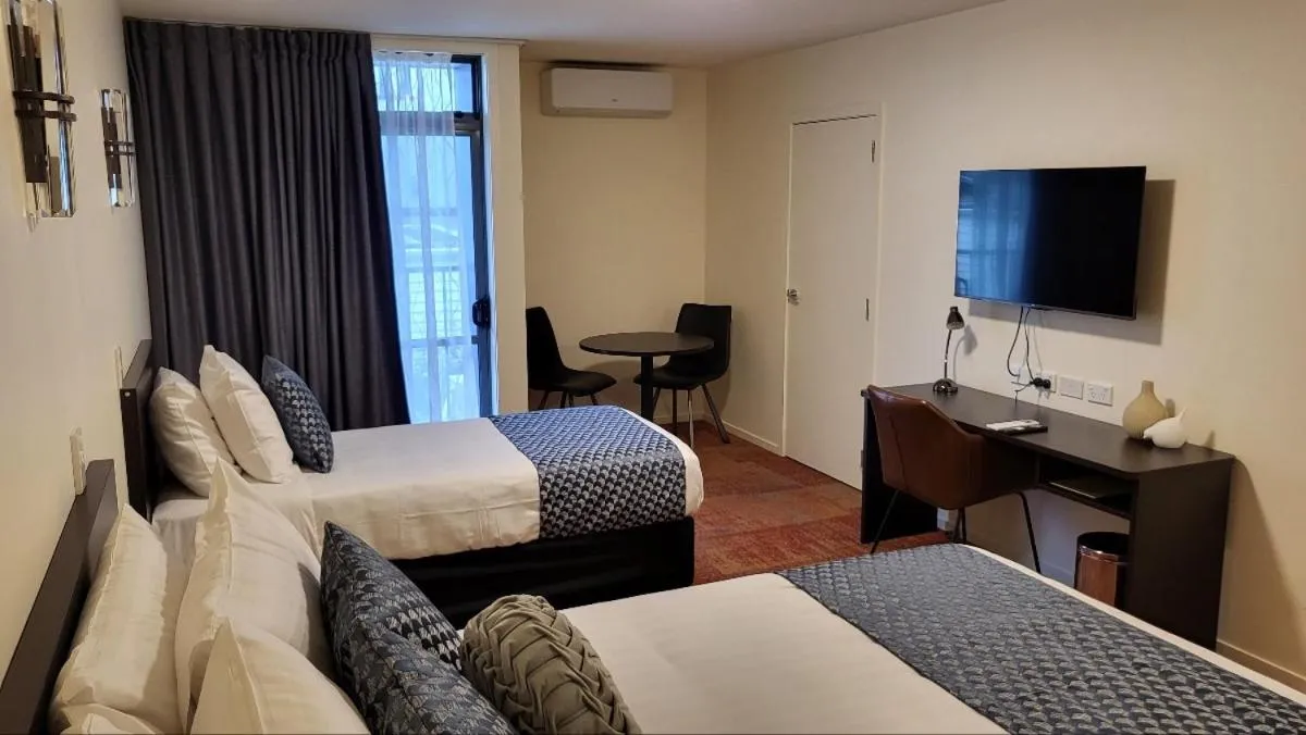 Bed in City of Sails Motel