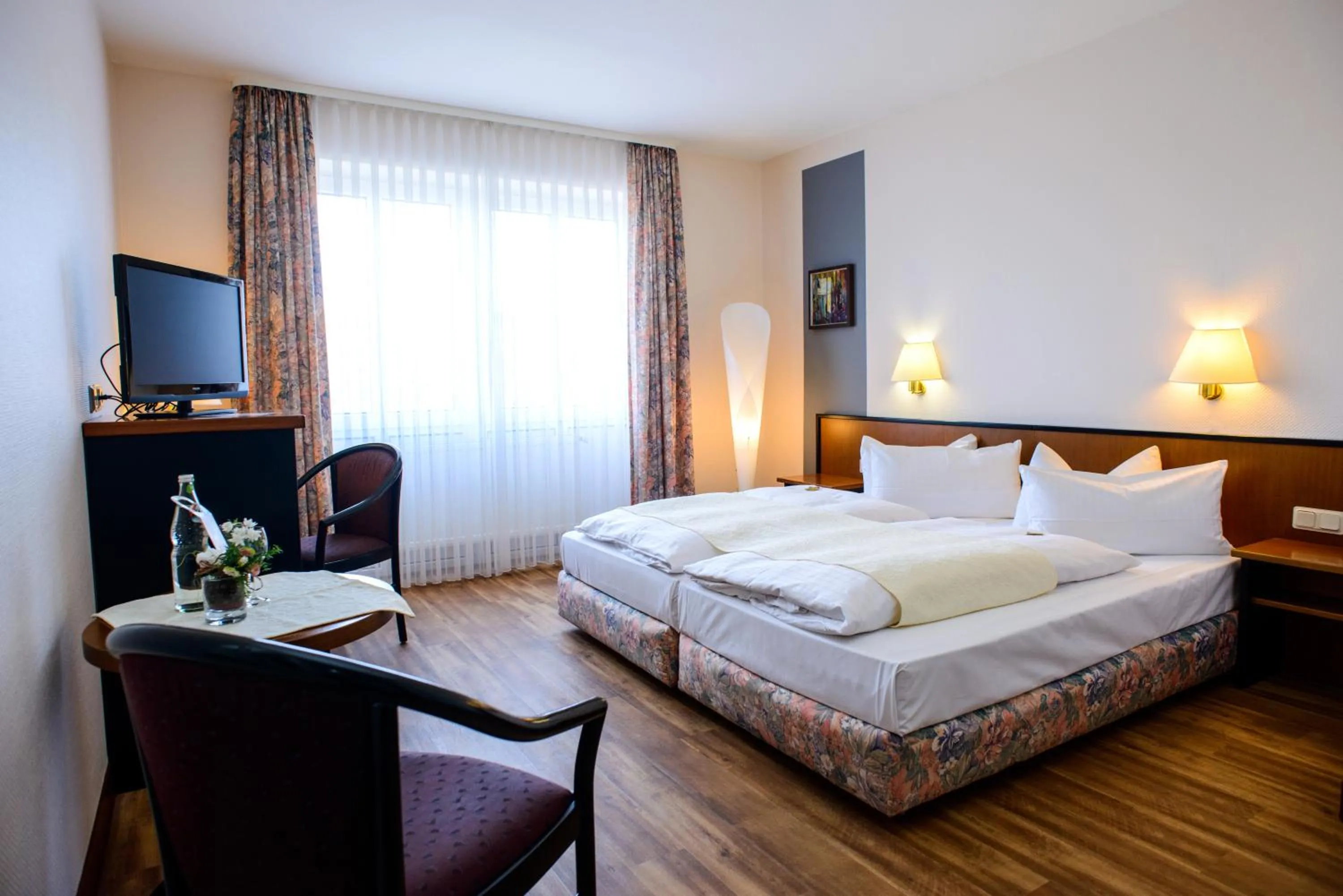 Seating area, Bed in City Hotel Aschersleben