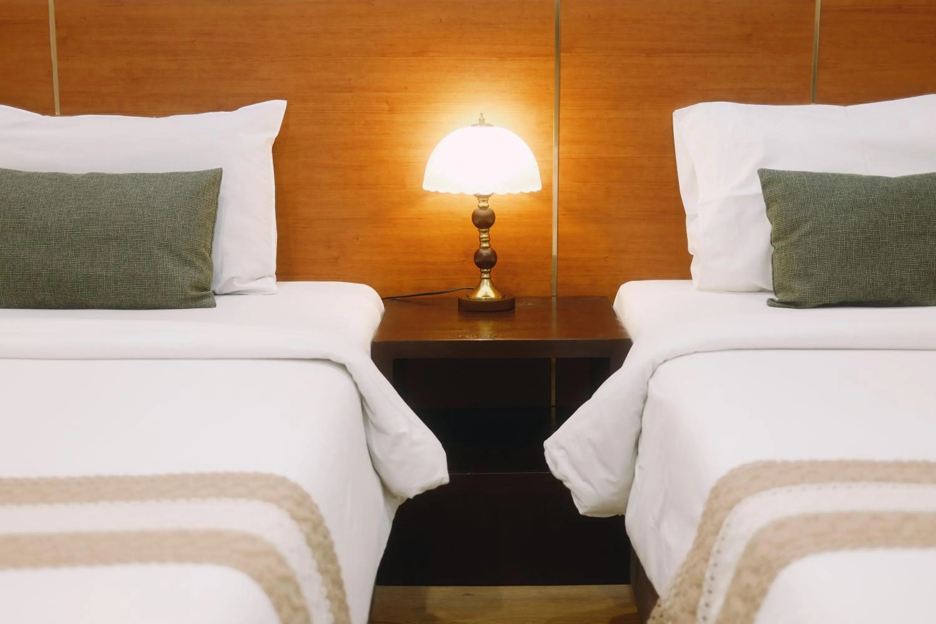 Bed in La Burie Gallery Hotel