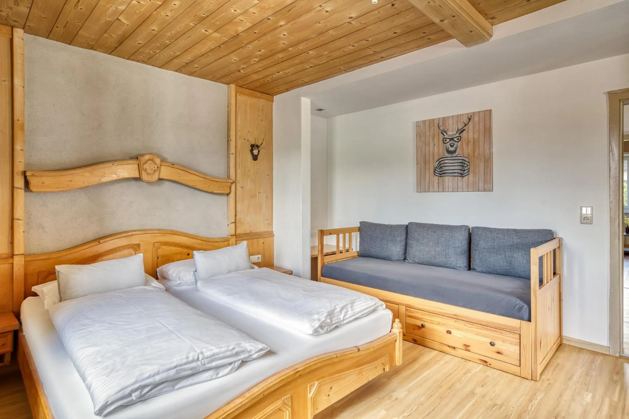 Living room, Bed in Boutiquehotel ZOMM in Seefeld