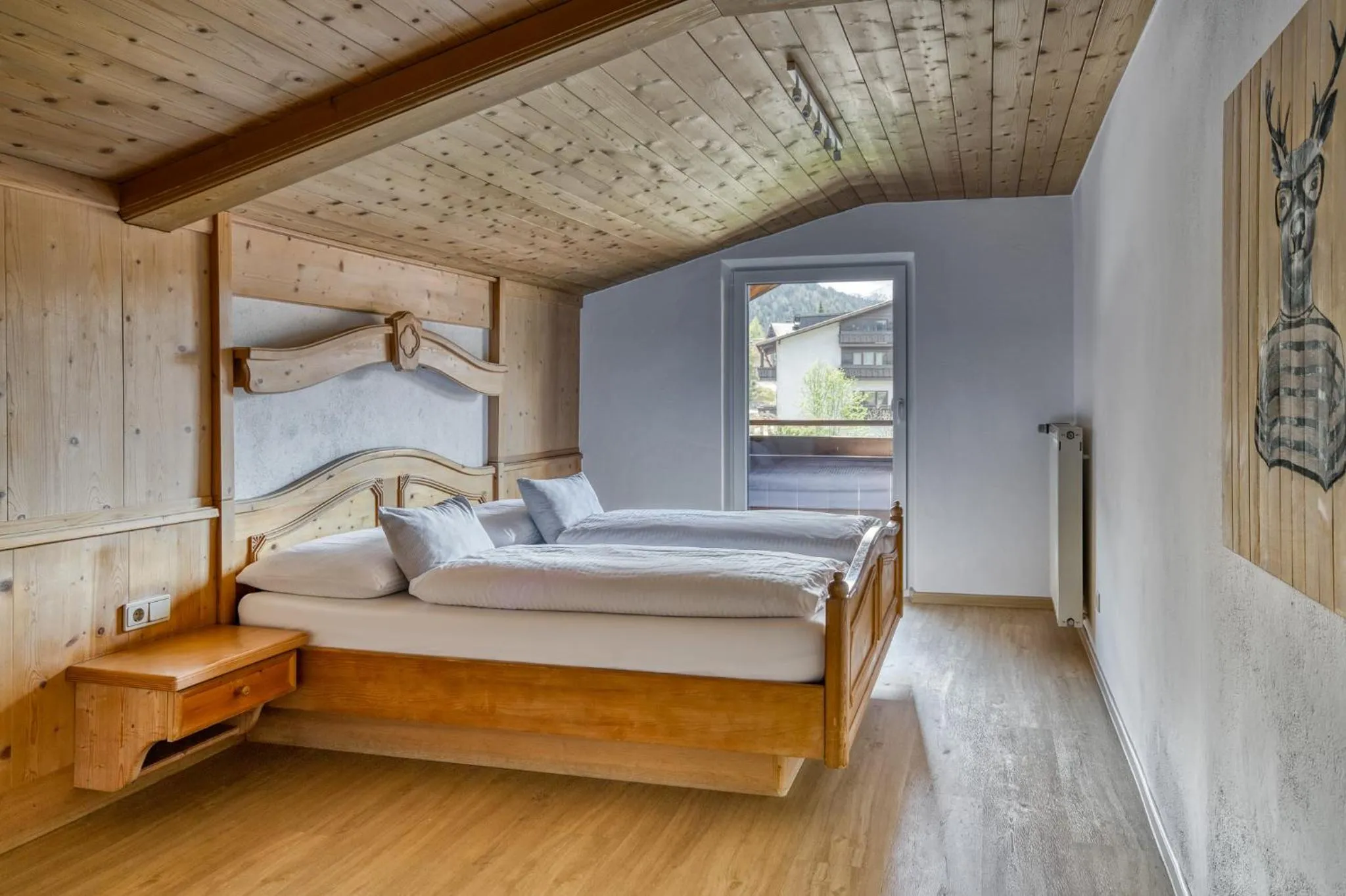 Photo of the whole room, Bed in Boutiquehotel ZOMM in Seefeld
