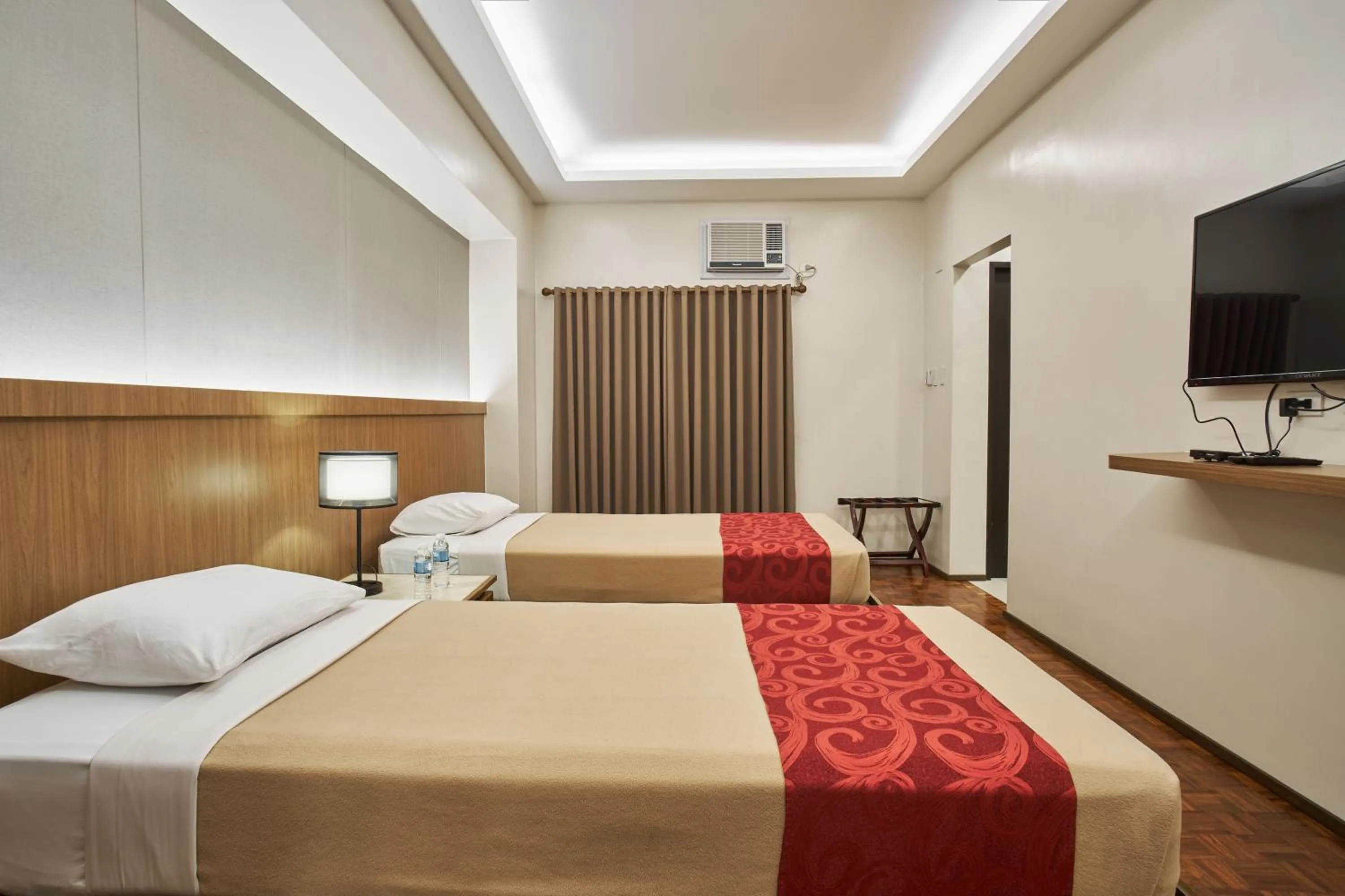 Bed in Tropicana Suites