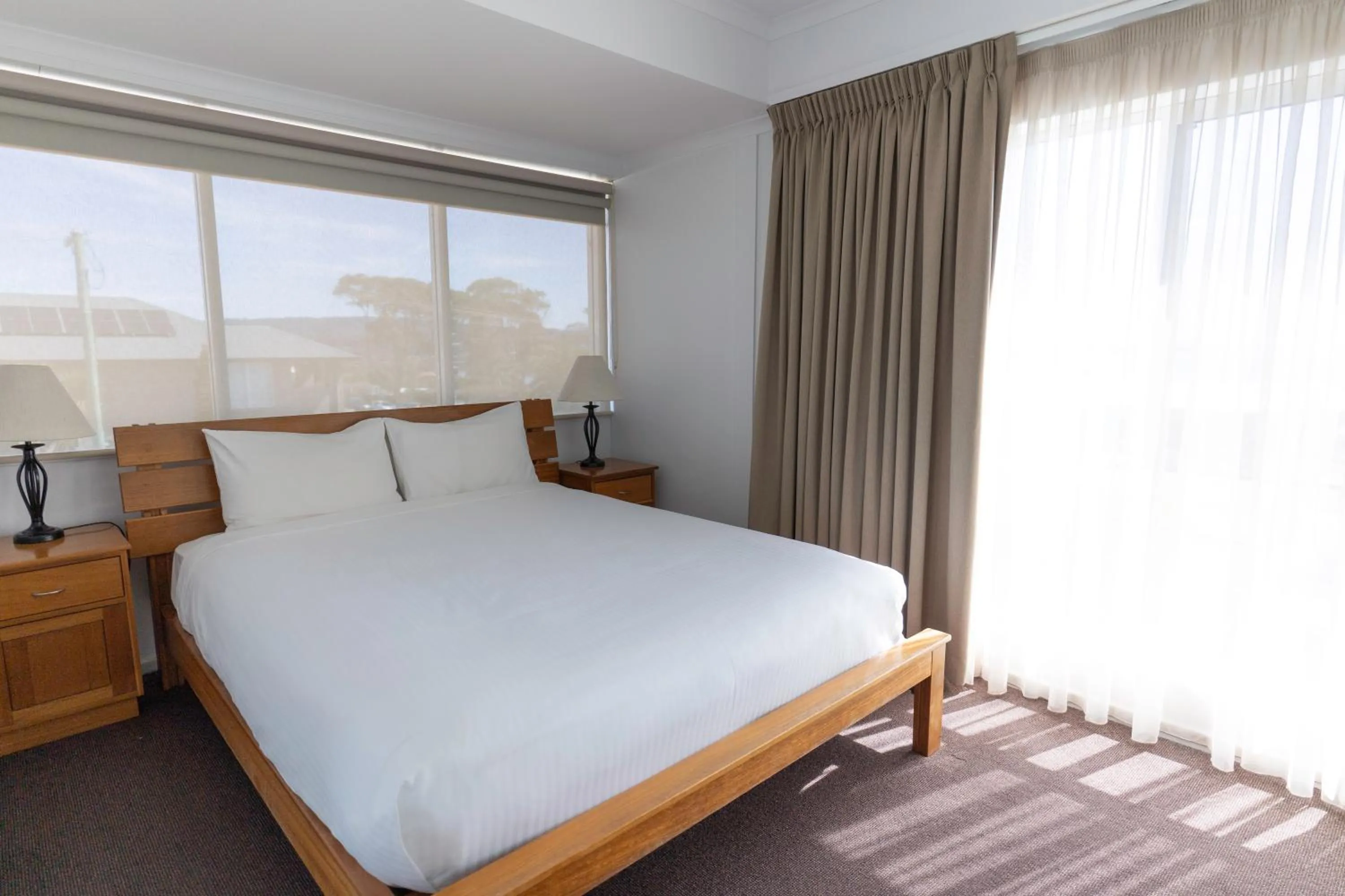 Bed in Amooran Oceanside Apartments and Motel