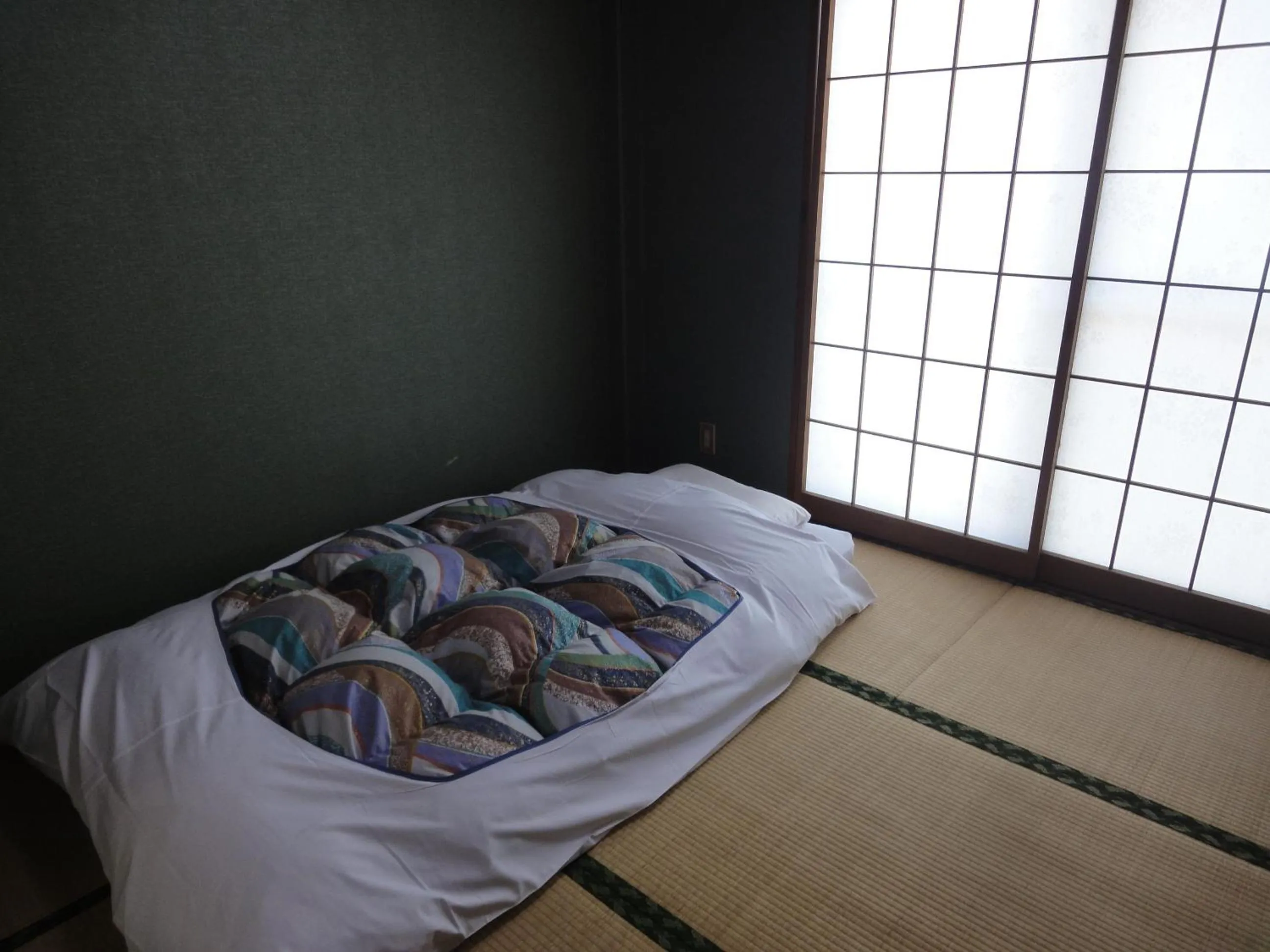 Bed in Hotel Sankyu