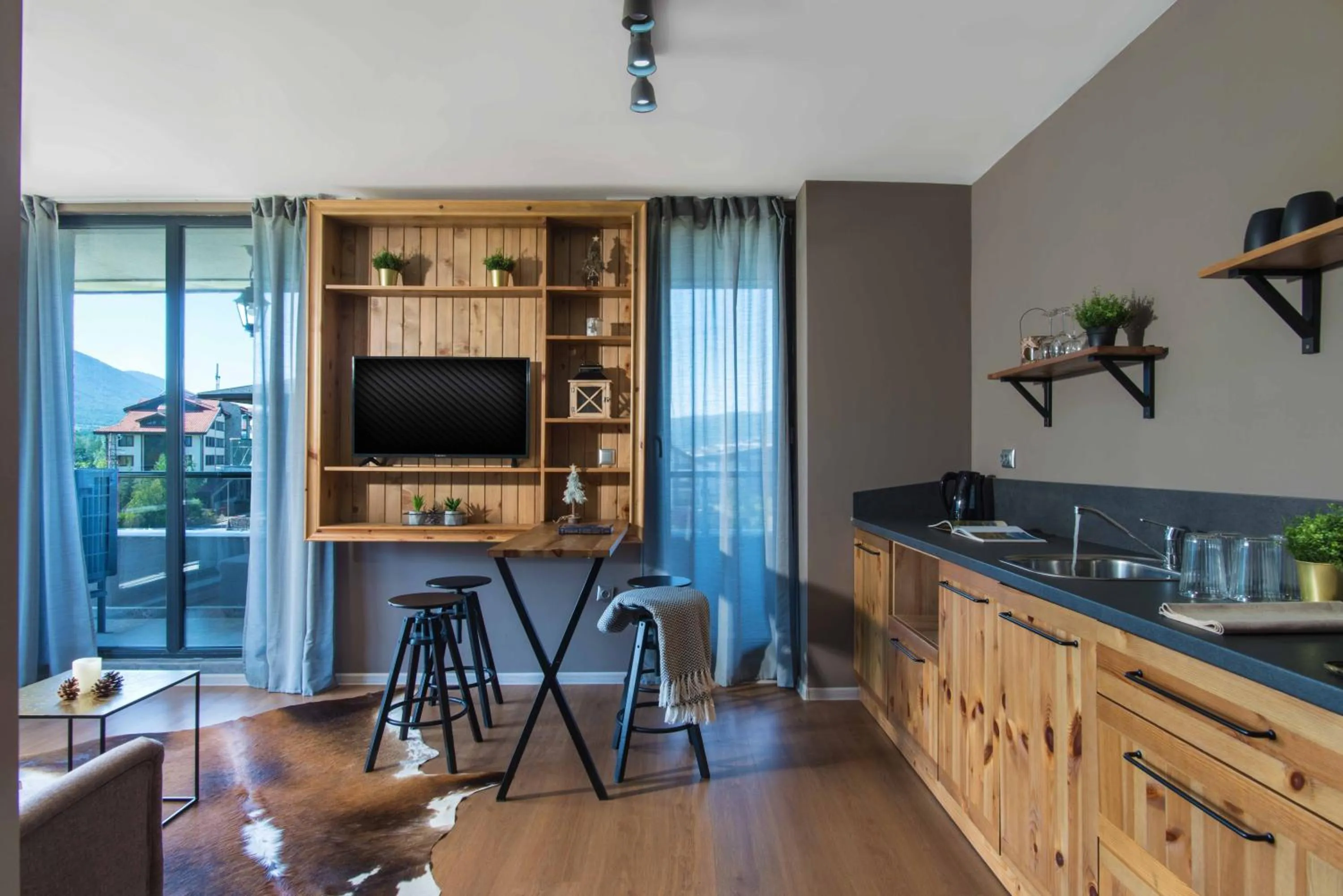 Communal lounge/ TV room in Cornelia Deluxe Residence