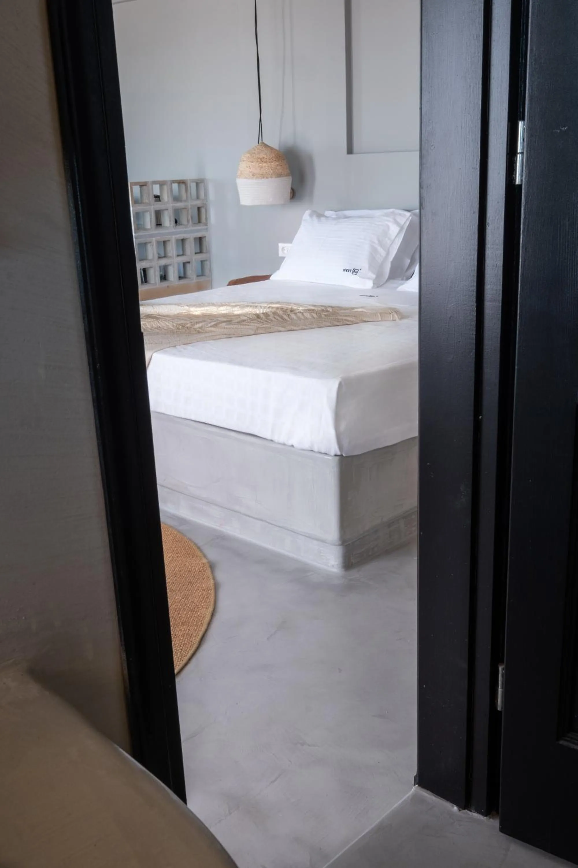 Bed in IfestAu.4 Suites