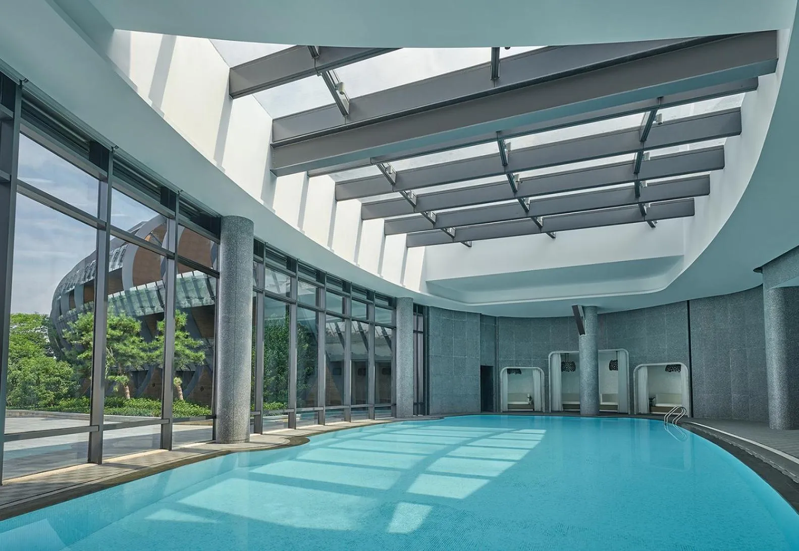 Swimming pool in InterContinental Shanghai Harbour City by IHG