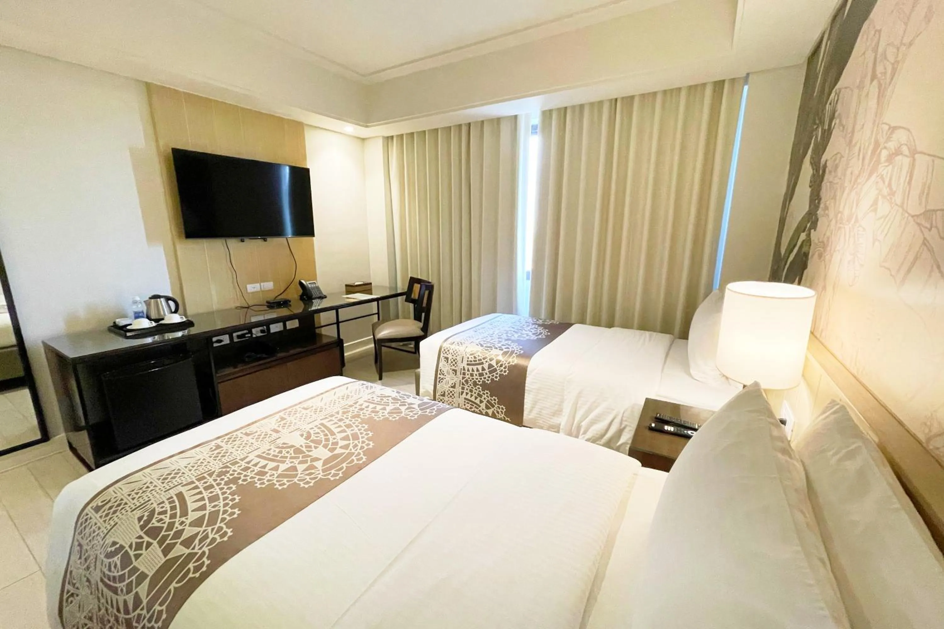 Bed in Mella Hotel Manila near NAIA Airport