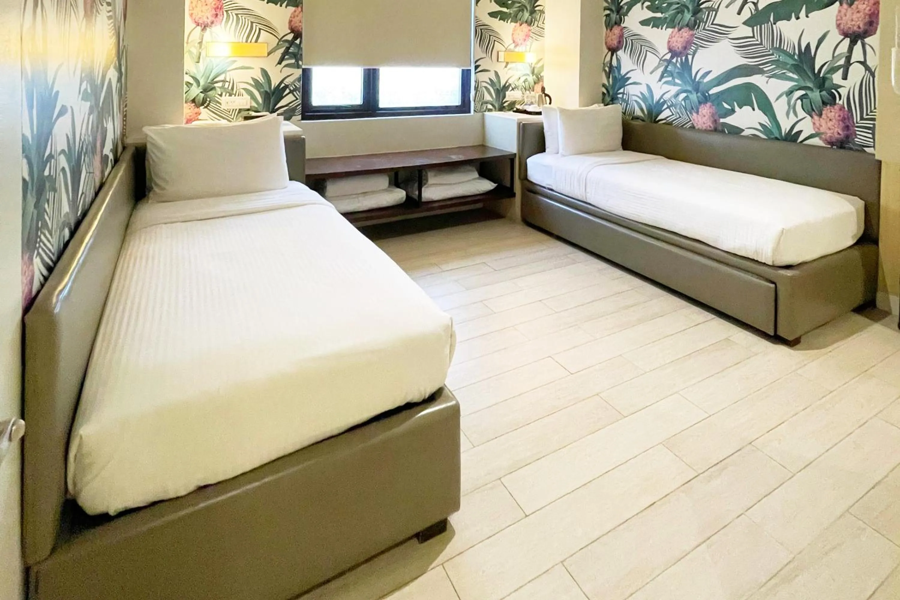 Bed in Mella Hotel Manila near NAIA Airport