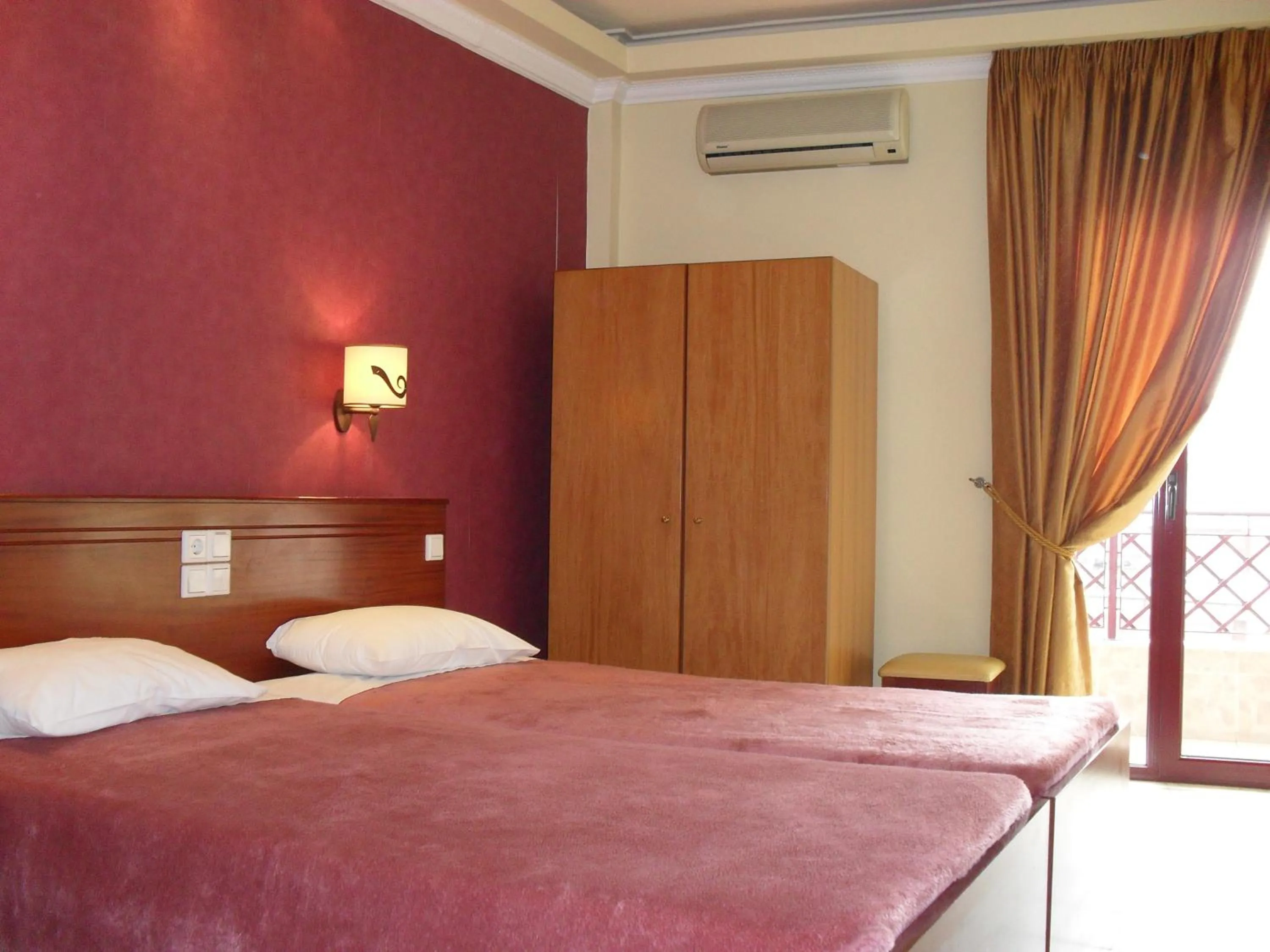 Bed in Hotel Olympion