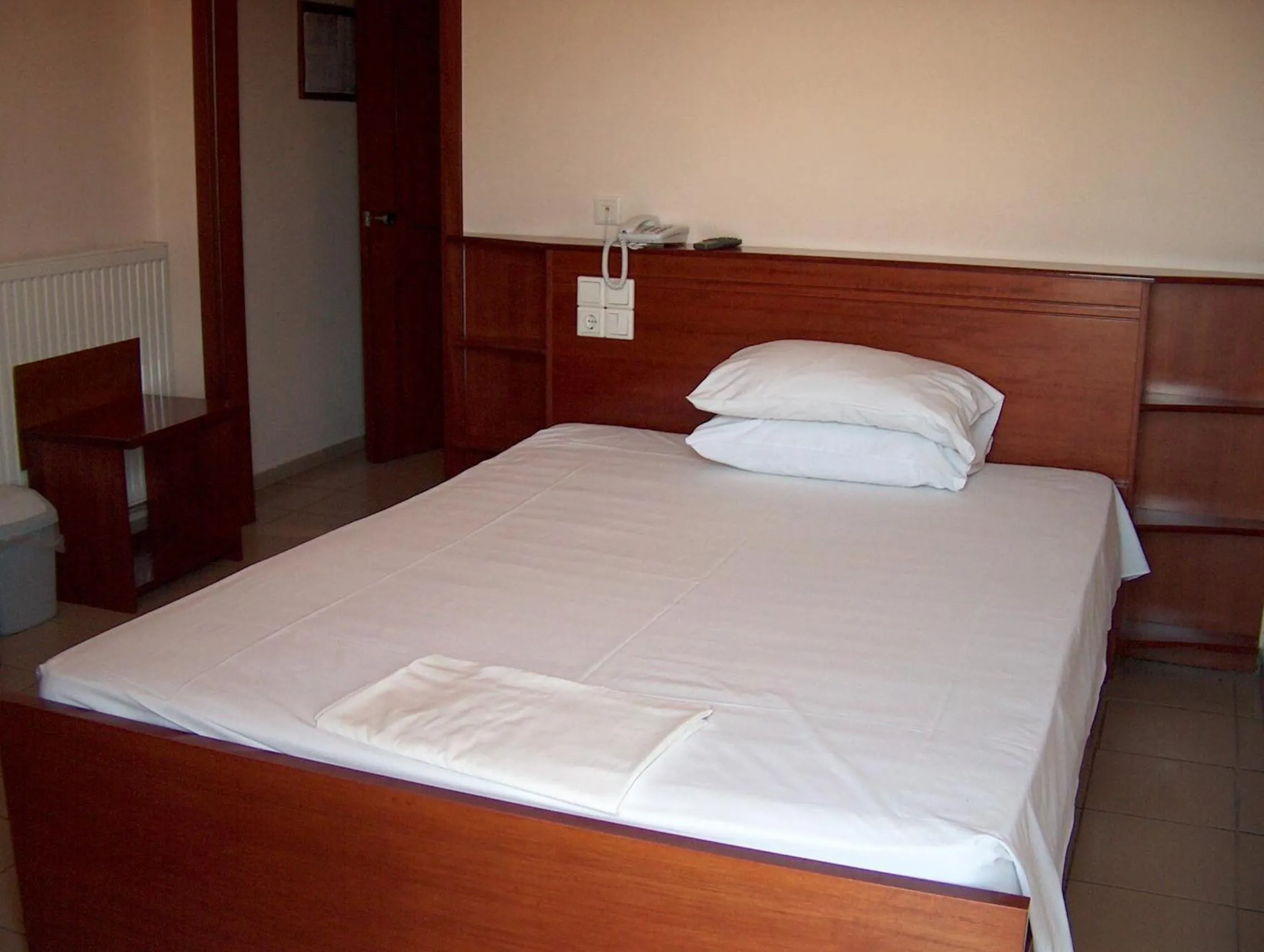 Bed in Hotel Olympion