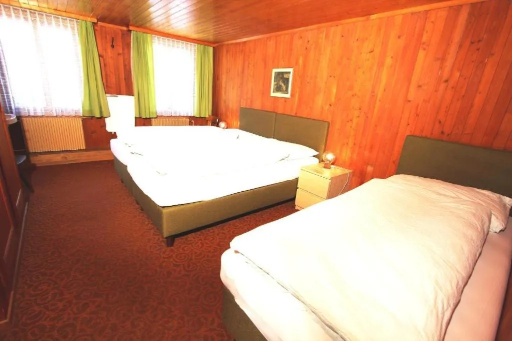 Bed in Hotel-Restaurant Alpina